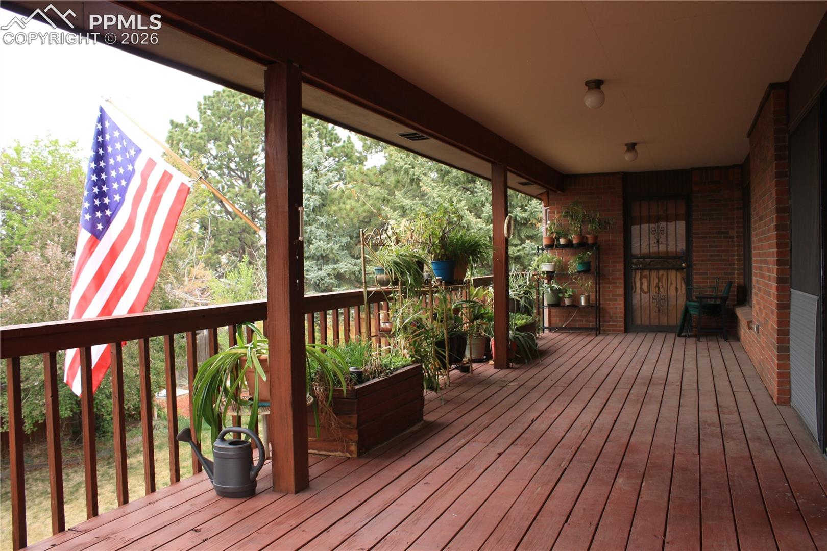 Main level, covered deck with built in garden planter