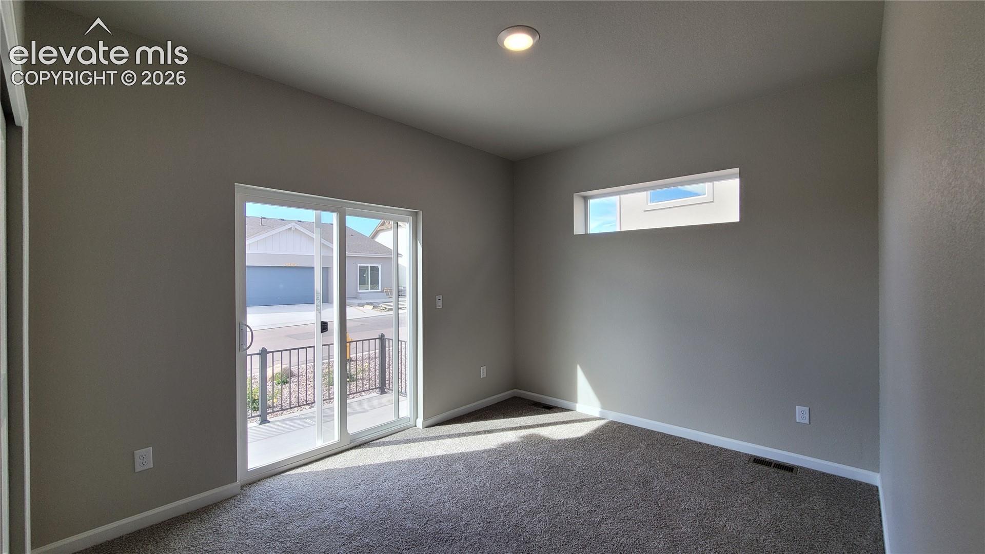 3rd Bedroom with a sliding glass door out to patio! 