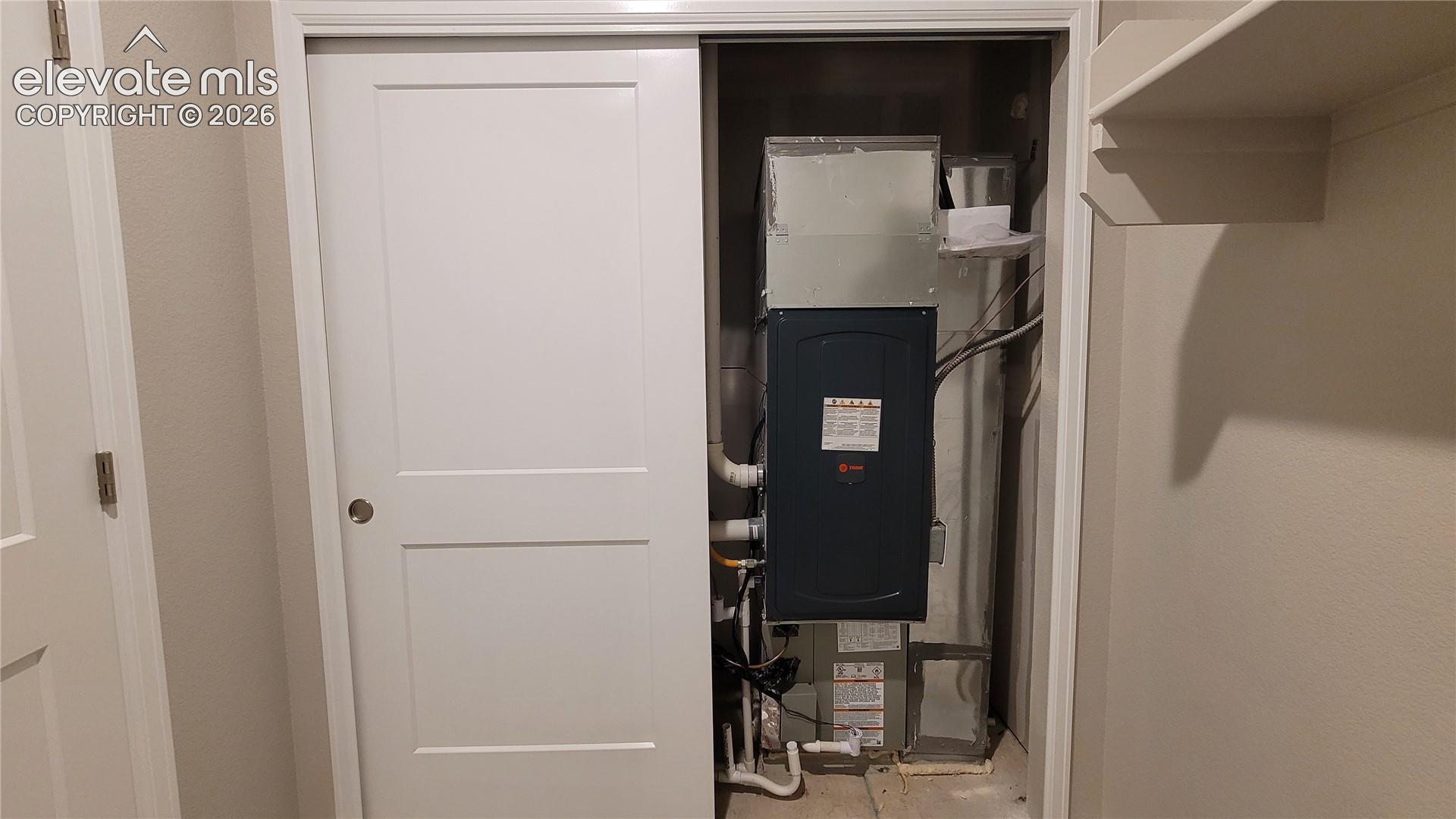 Utility closet in the laundry room for easy access to the 96% energy efficient furnace with a 2-stage motor! 