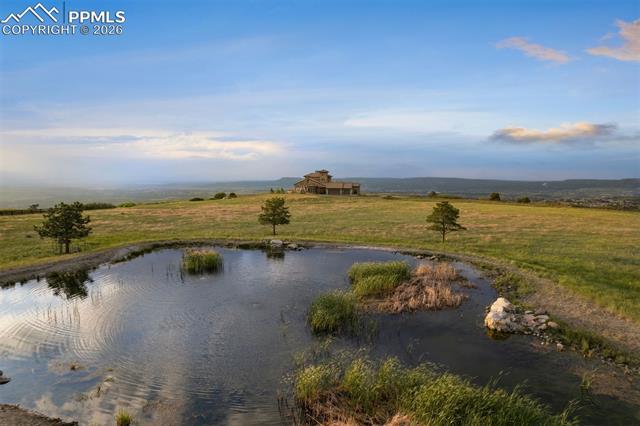 Set on 35 acres atop a secluded mesa with dynamic topography and a private pond.