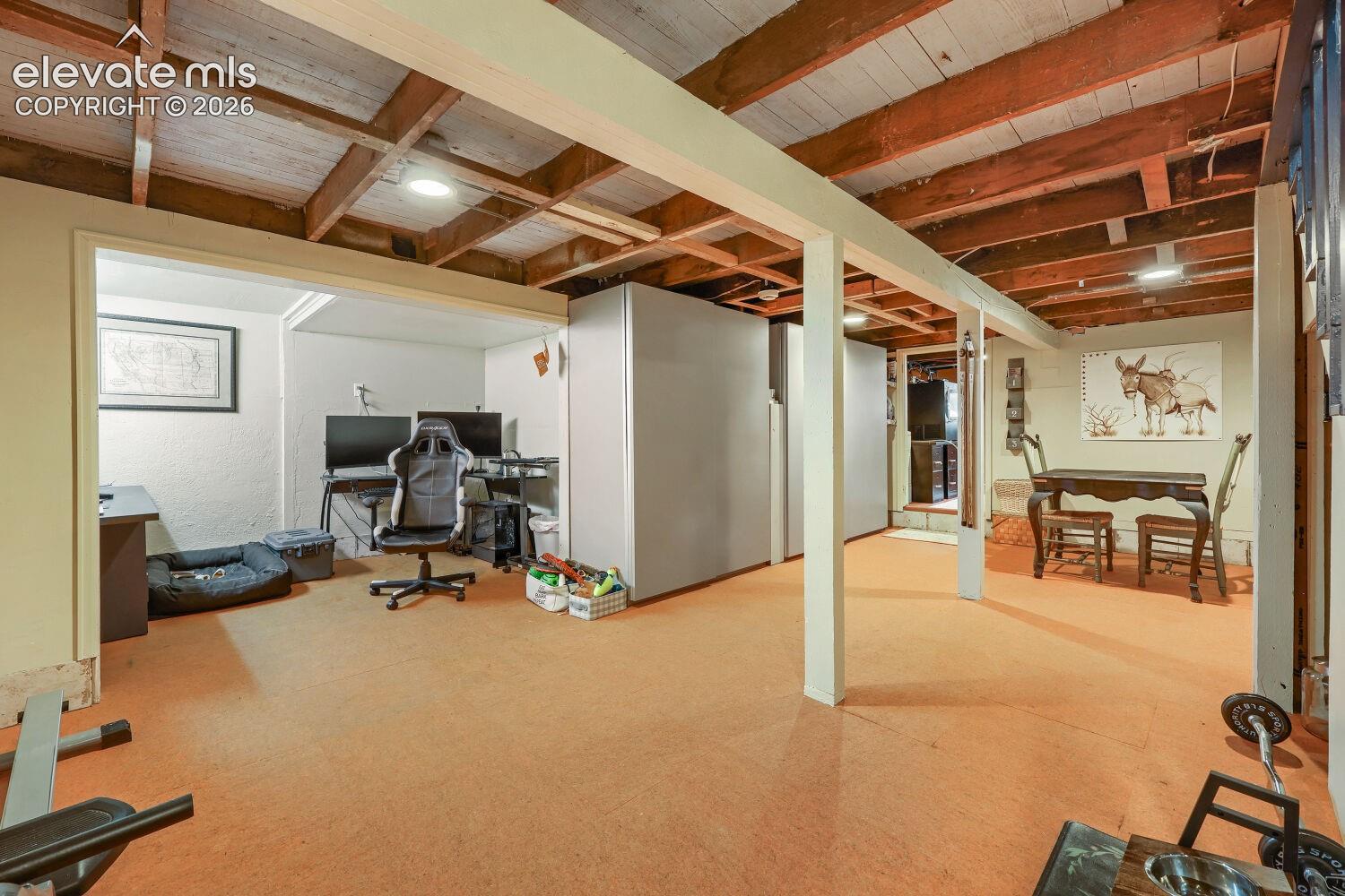 Exposed wood beam ceiling with recessed lighting