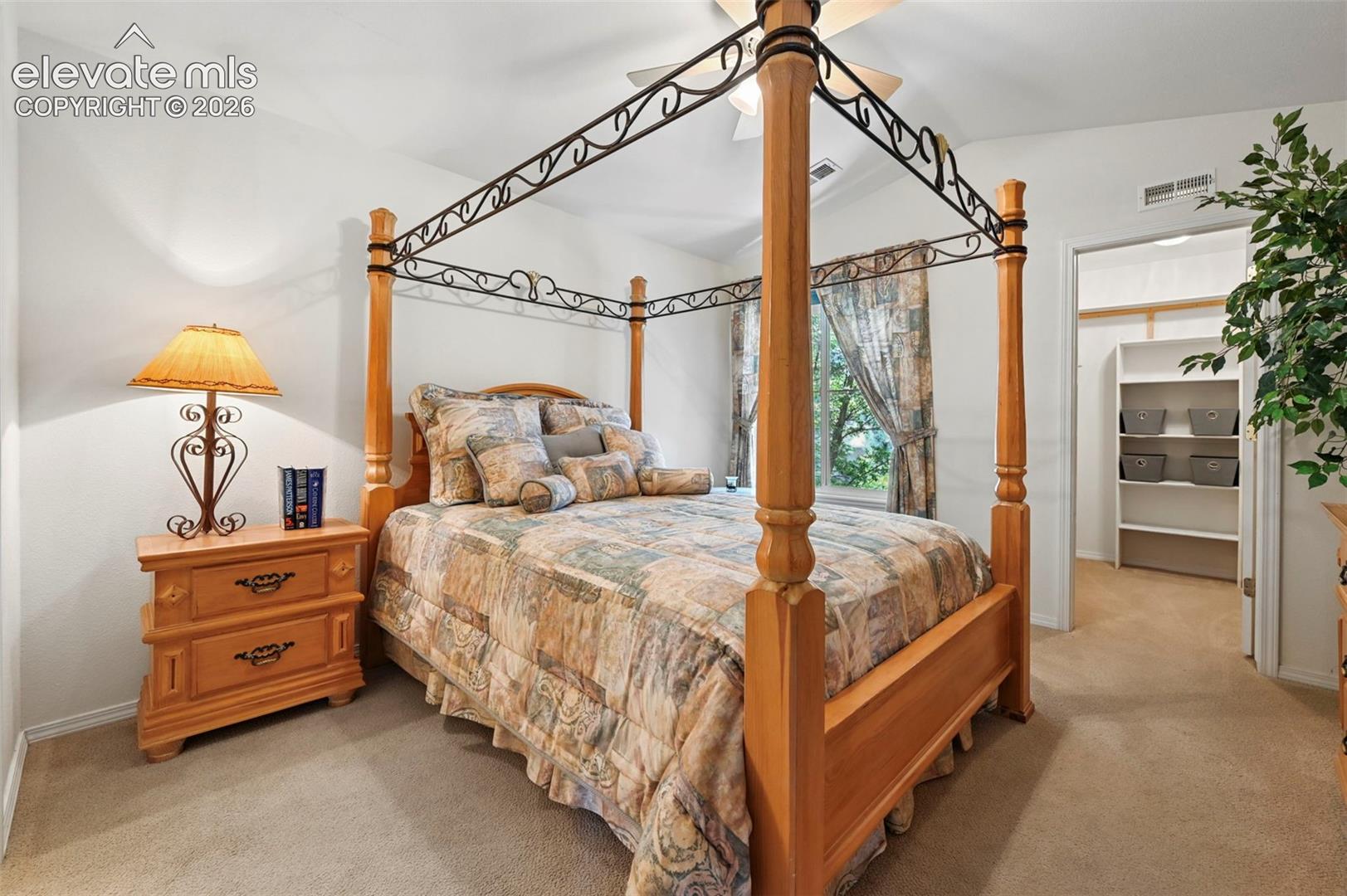 primary bedroom with large walk-in closet