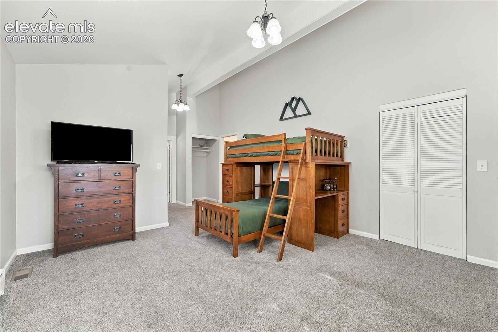 Second Bedroom main floor, with walk in closets and private access to second bathroom
