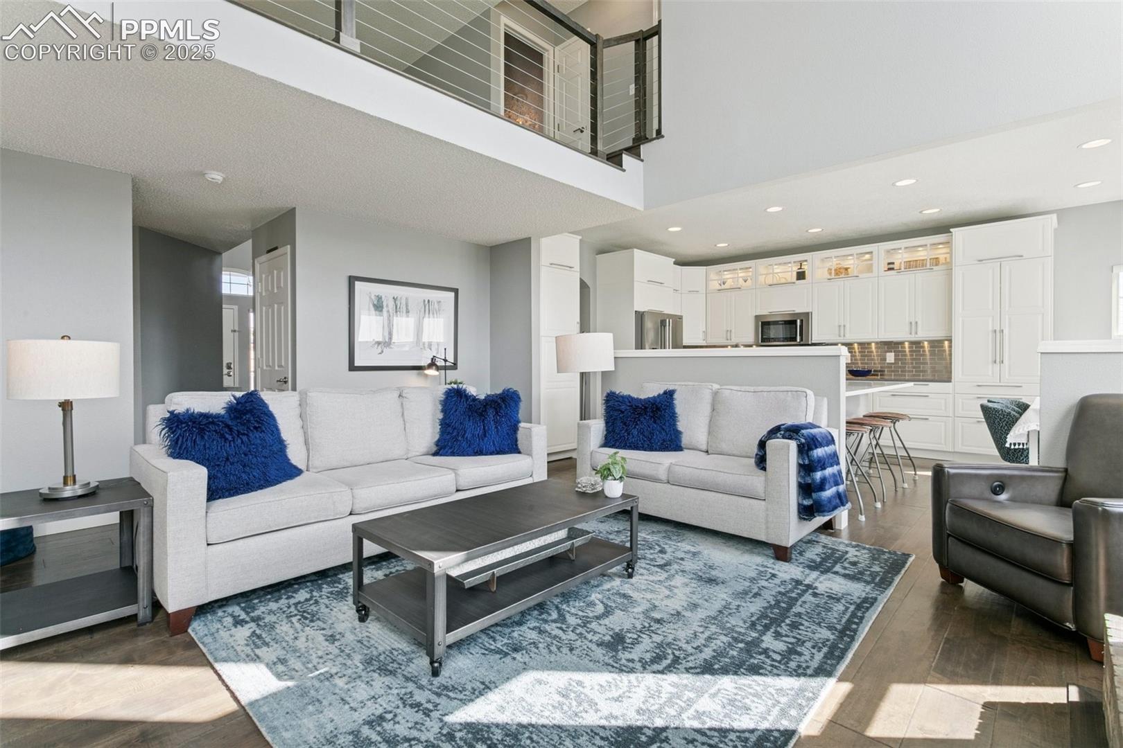 Main level family room with soaring ceilings and plenty of space for furniture placement!