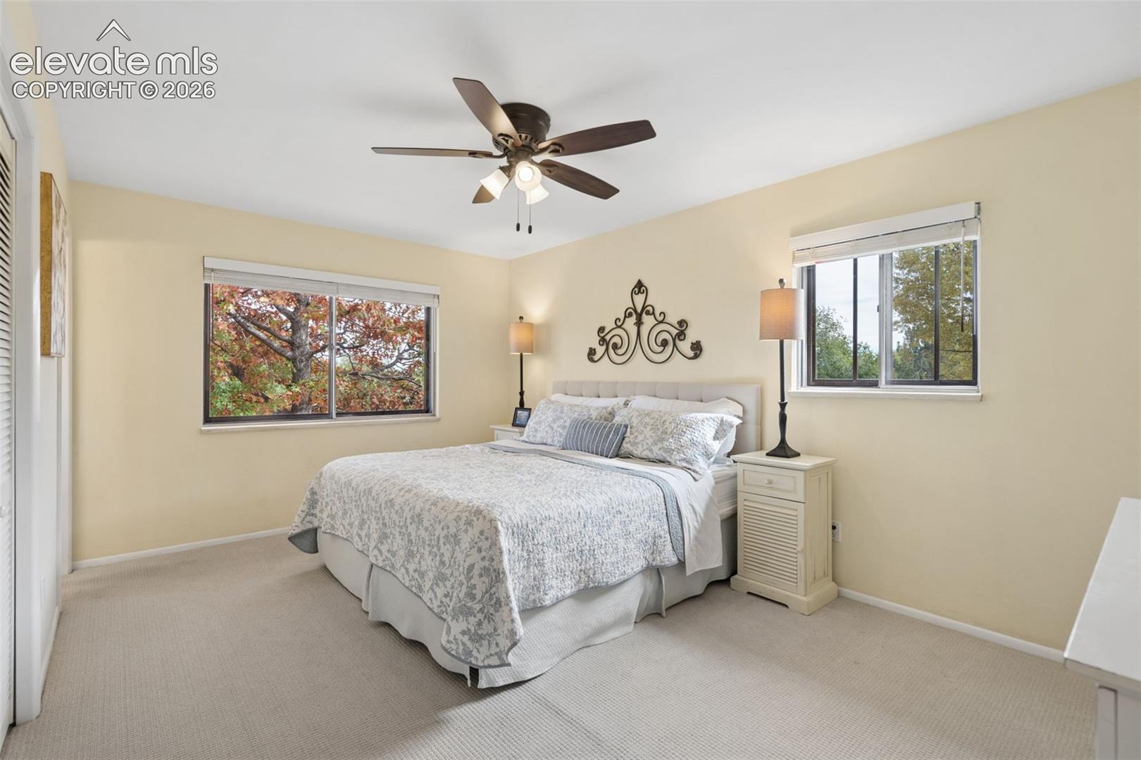 Primary bedroom with beautiful views out the windows