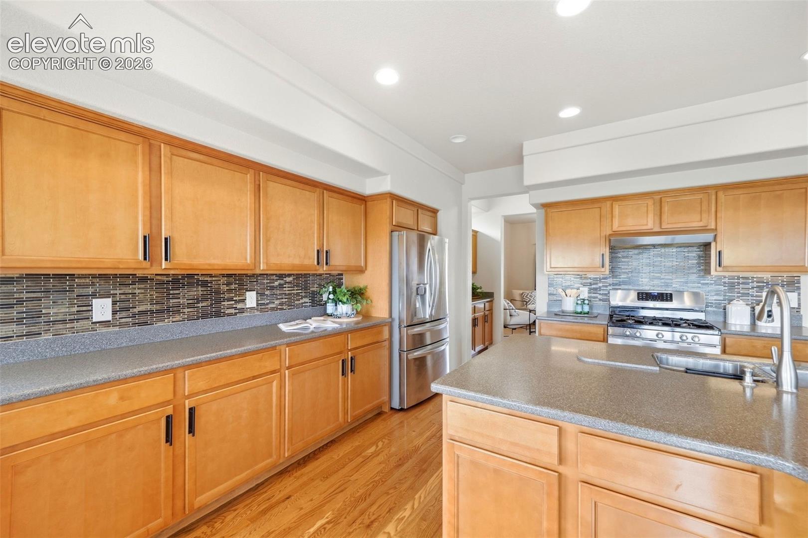 Eat in Kitchen with SS appliances, butlers pantry and hard wood flooring
