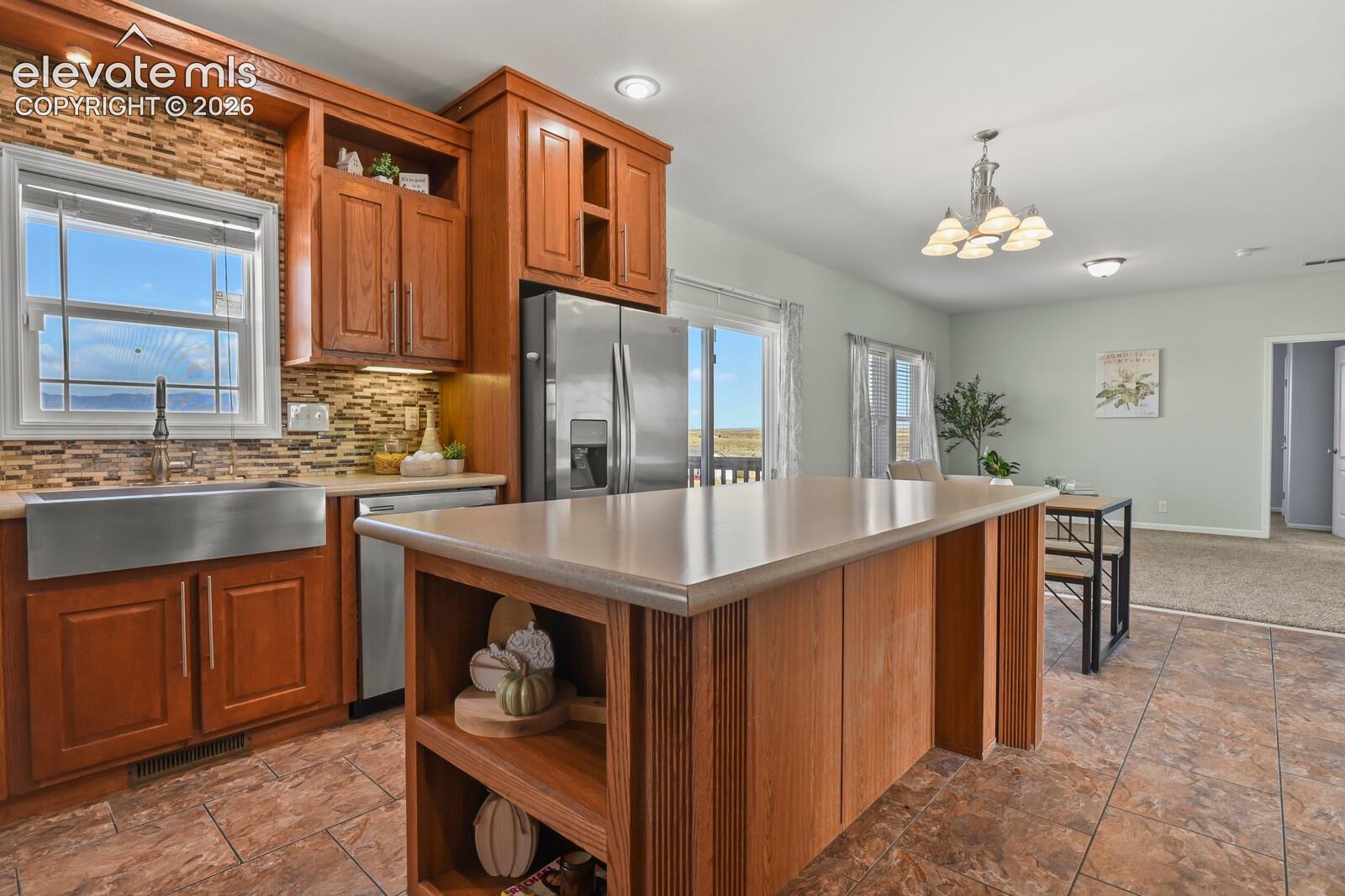 The kitchen has a large farmhouse sink. 