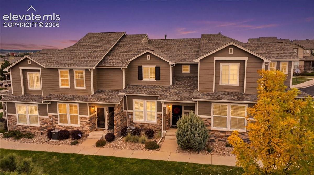 Stunning Pikes Peak views, open space, and low-maintenance living in the heart of Monument! This immaculate, single-owner townhome offers 2 bedrooms, 2.5 bathrooms, and an attached 2-car garage. Beautifully maintained and lightly lived in, the home enjoys a desirable position overlooking open space, with sweeping mountain views and a convenient location near Lewis-Palmer High School.Inside, beautiful wood flooring, high ceilings, and upgraded shutters on every window create a bright, inviting atmosphere. The open main level connects the living and dining areas with a well-appointed kitchen featuring upgraded 42-inch cabinetry with crown molding and a convenient breakfast bar with a pass-through to the dining area. A main-level powder room adds everyday convenience.Upstairs, the spacious primary suite features a walk-in closet and private bathroom with double vanities. A second bedroom, additional full bathroom, and laundry area with included washer and dryer complete the upper level.Pride of ownership is evident throughout, with thoughtful improvements including a whole-house water softener installed in 2025, a water heater replaced in 2020, and a new roof and stucco on the exterior.Enjoy the convenience of HOA-maintained exterior upkeep, landscaping, snow removal, and trash service, allowing more time to enjoy the surrounding Colorado lifestyle. The property's setting offers beautiful Pikes Peak views, open space directly in front, and even the opportunity to watch baseball games at nearby Lewis-Palmer High School.Located in Monument's Woodmoor Park community, with convenient access to the YMCA, local trails, shopping, dining, I-25, and the United States Air Force Academy, this exceptionally maintained townhome combines quality finishes, scenic surroundings, and easy living in the Tri-Lakes area.