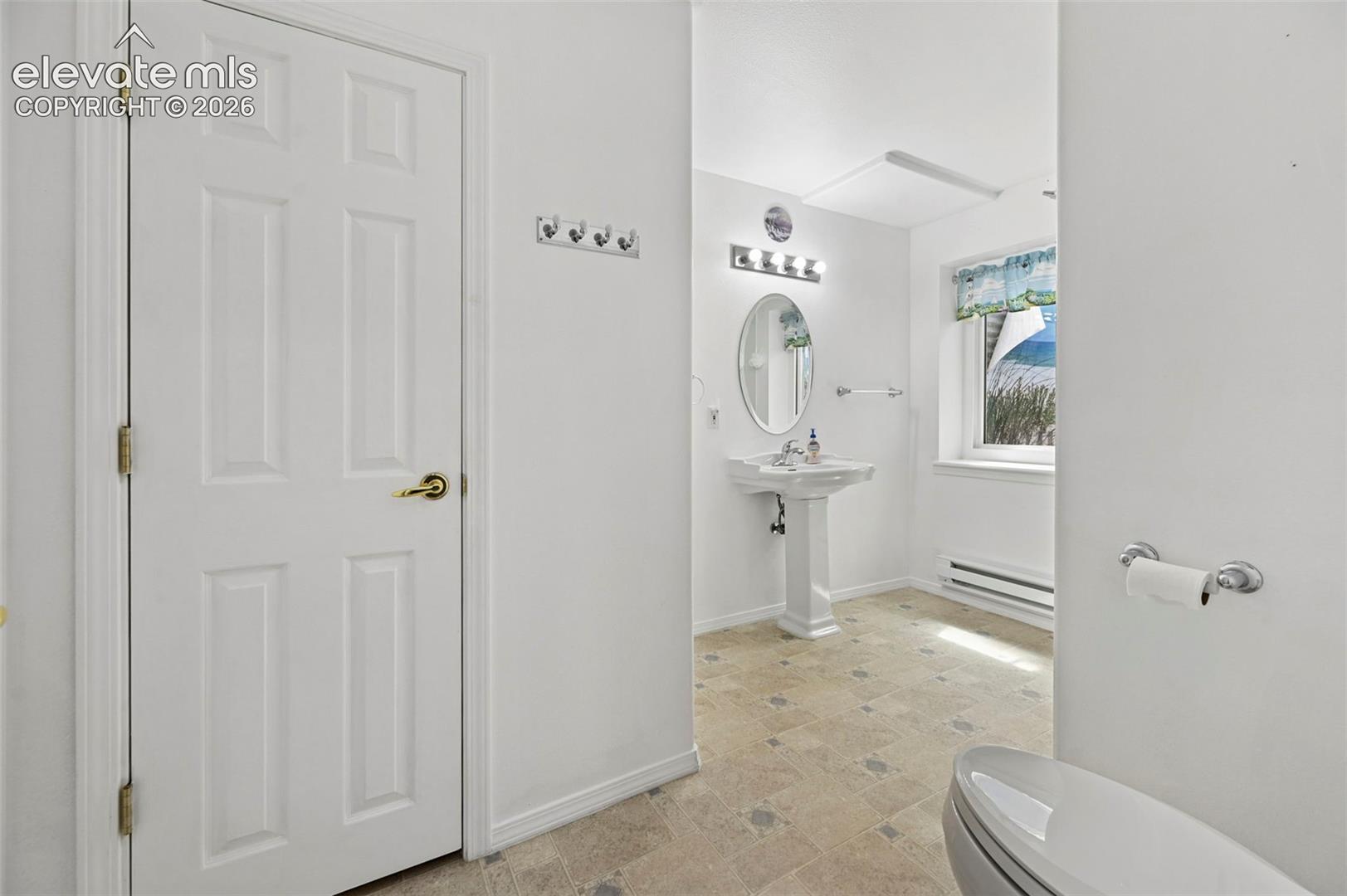White paneled door with brass hardware