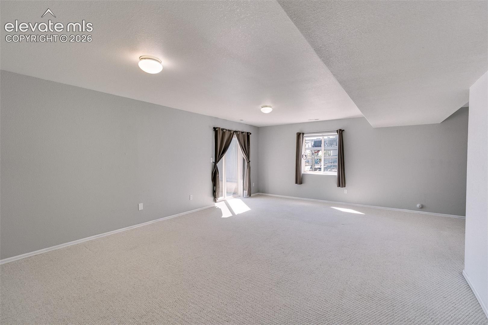 Basement Family Room with slider to the backyard.