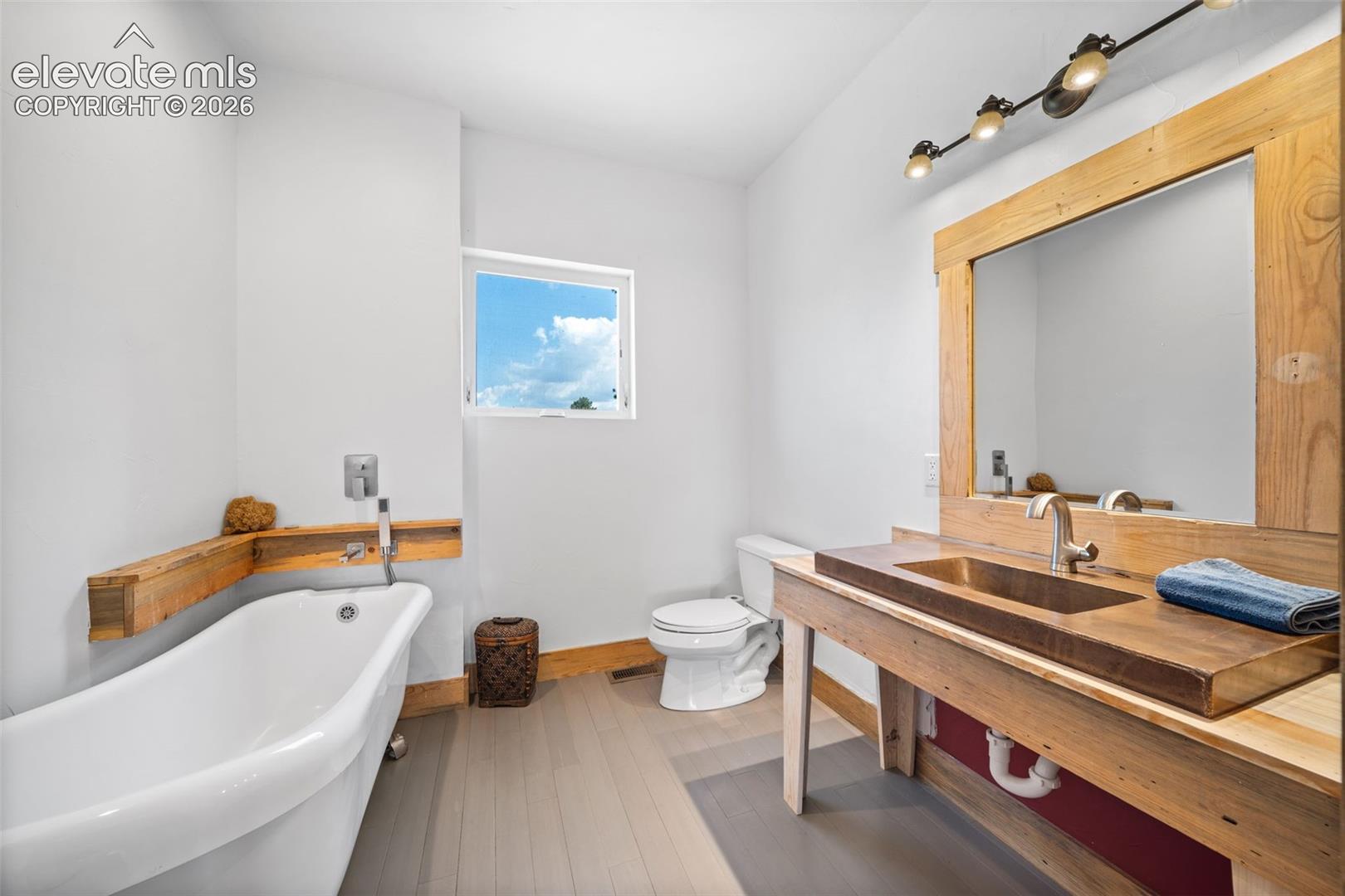 Main-level bathroom with a freestanding soaking tub.