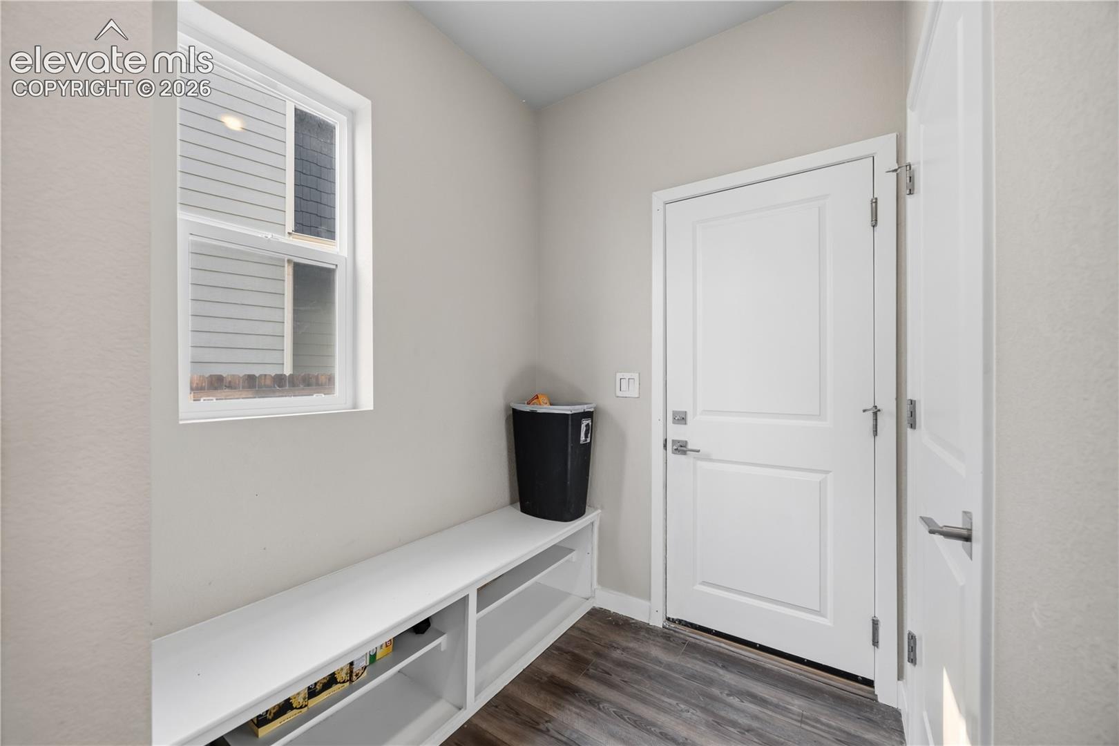 Mud Room with seated bench and garage access.
