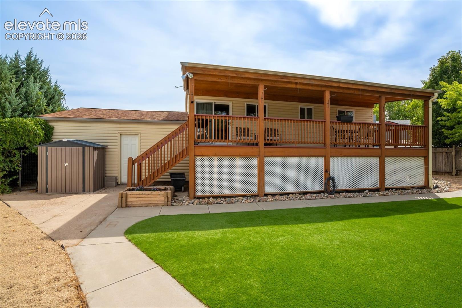 Low-maintenance turf + garden beds + a huge yard = less yard work, more actual enjoyment.