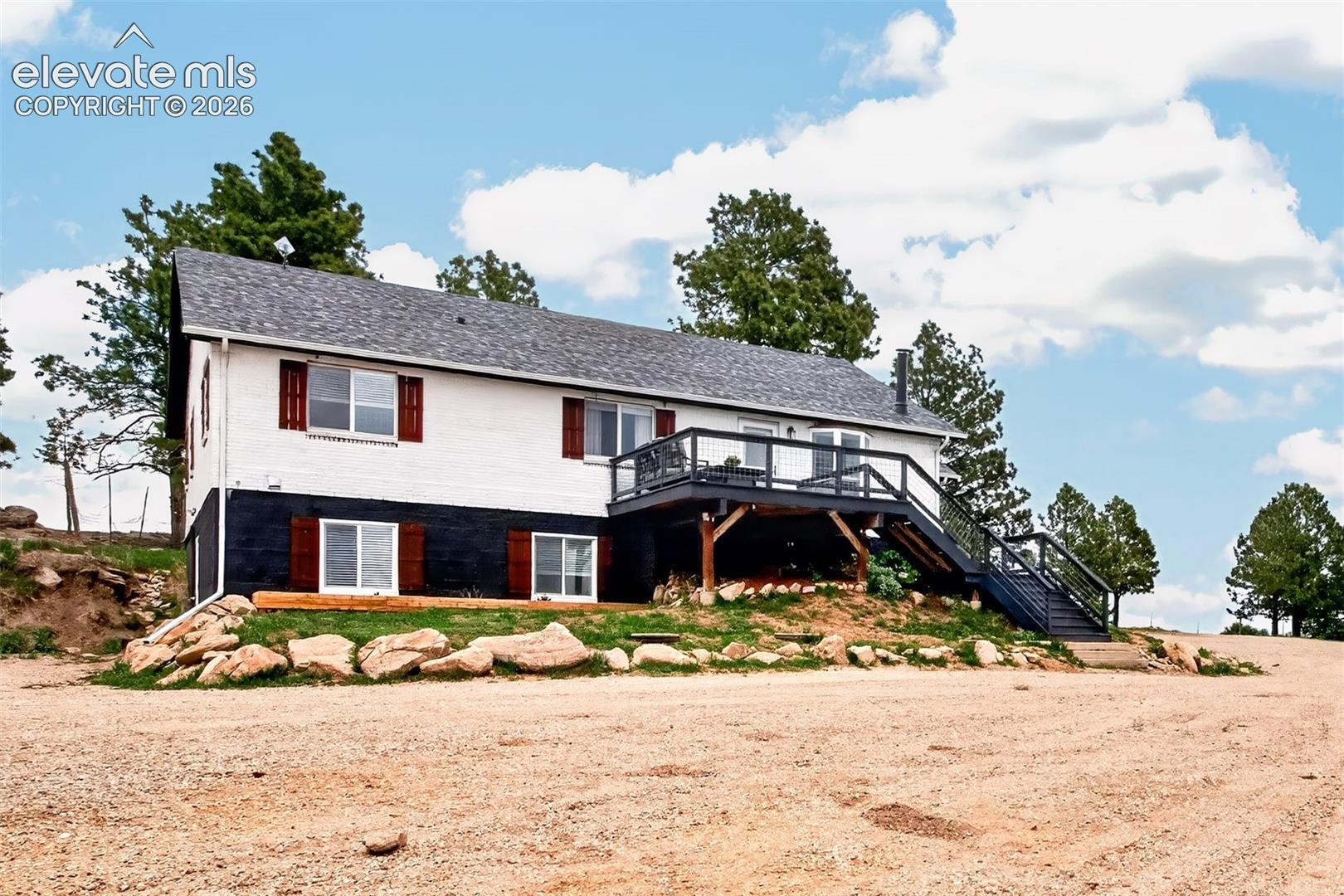 Side Entrance with Large Deck with unobstructed views of Pikes Peak!!!
