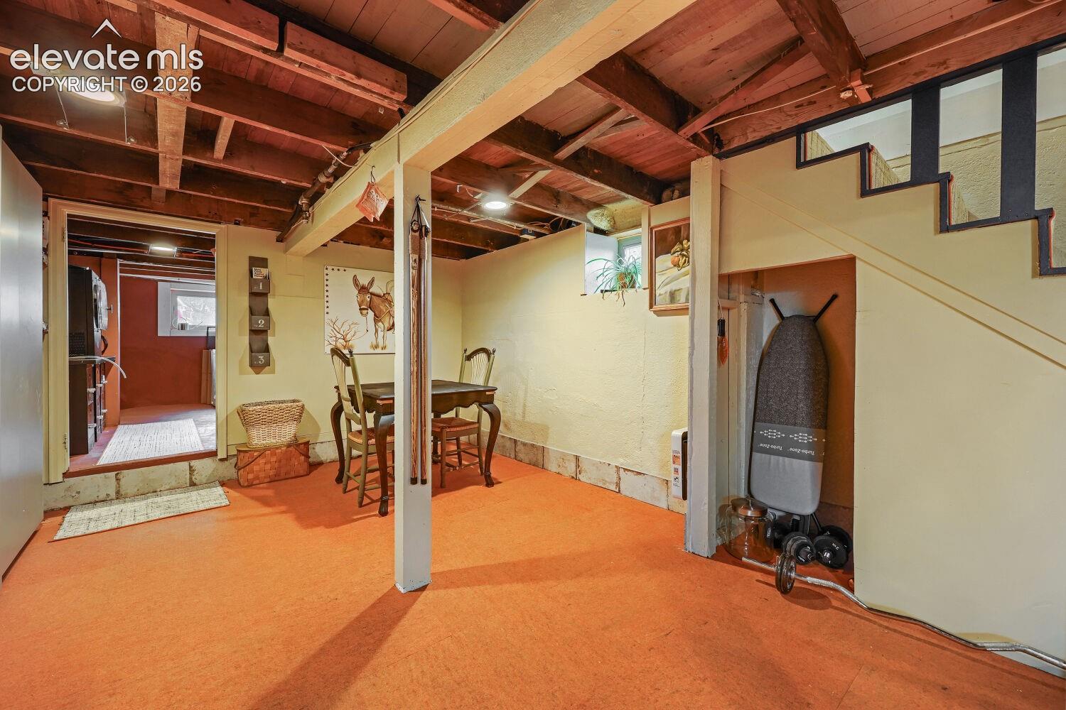 Exposed wood beam ceiling with recessed lighting
