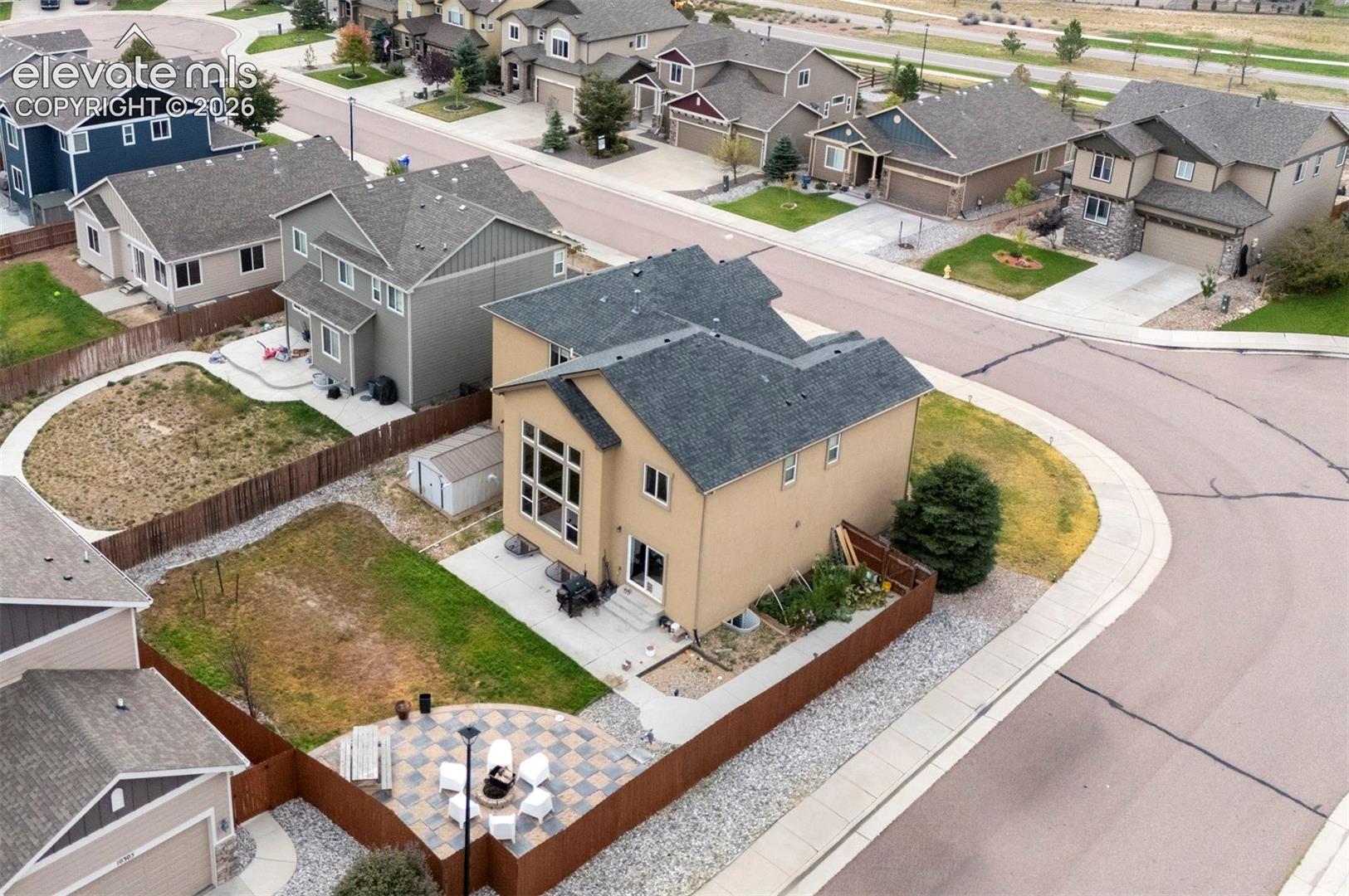Aerial view of the home and corner lot