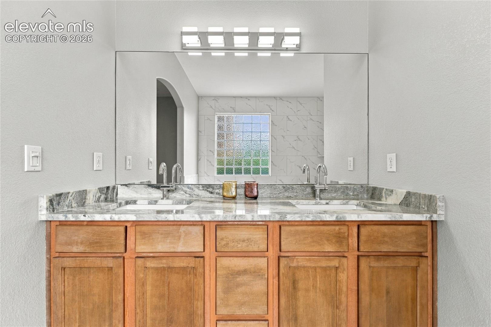 new high end granite, light fixture and bath hardware