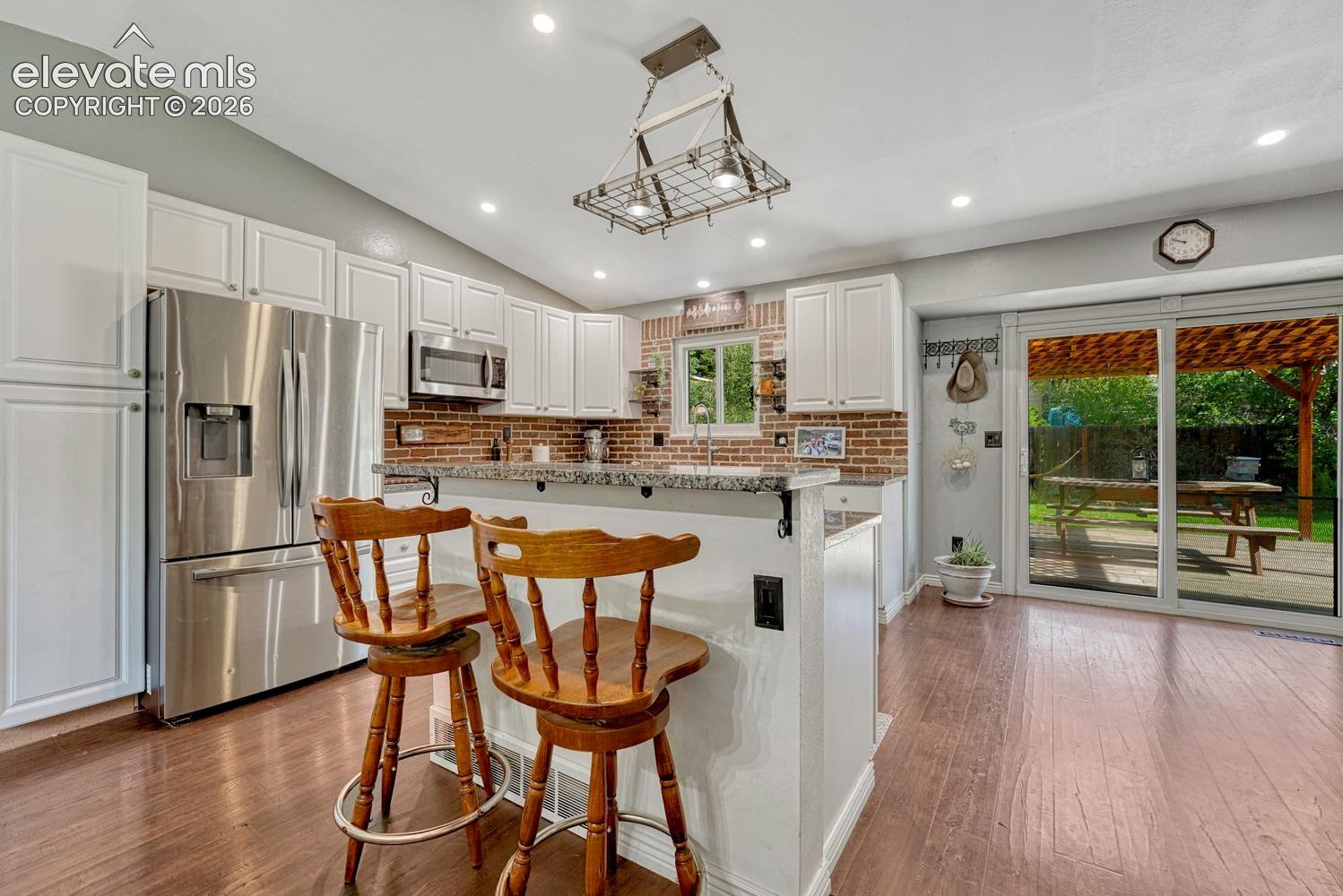 The Kitchen offers a breakfast bar and eat-in nook for informal dining.