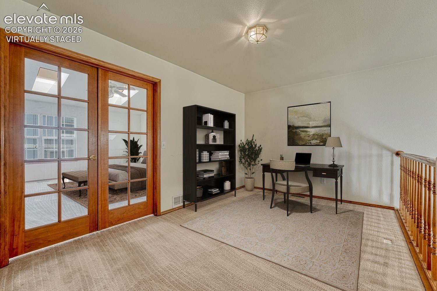 Loft is a flexible space, great for an office, study, or home gym. Virtually staged.