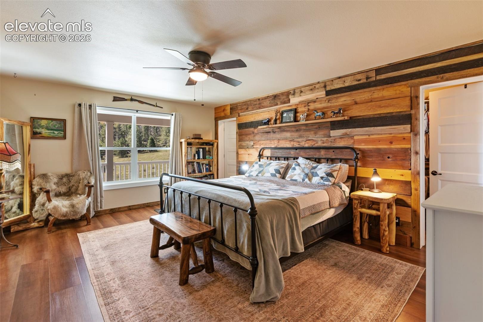 Primary bedroom with ensuite bath and walk-in closet. 