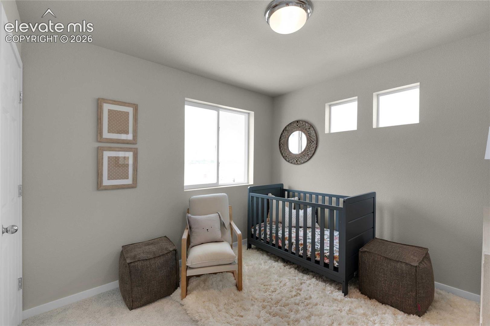Wall-to-wall carpeting with soft pile, neutral wall paint, two high horizontal windows, and two square windows
*photos of a model home*