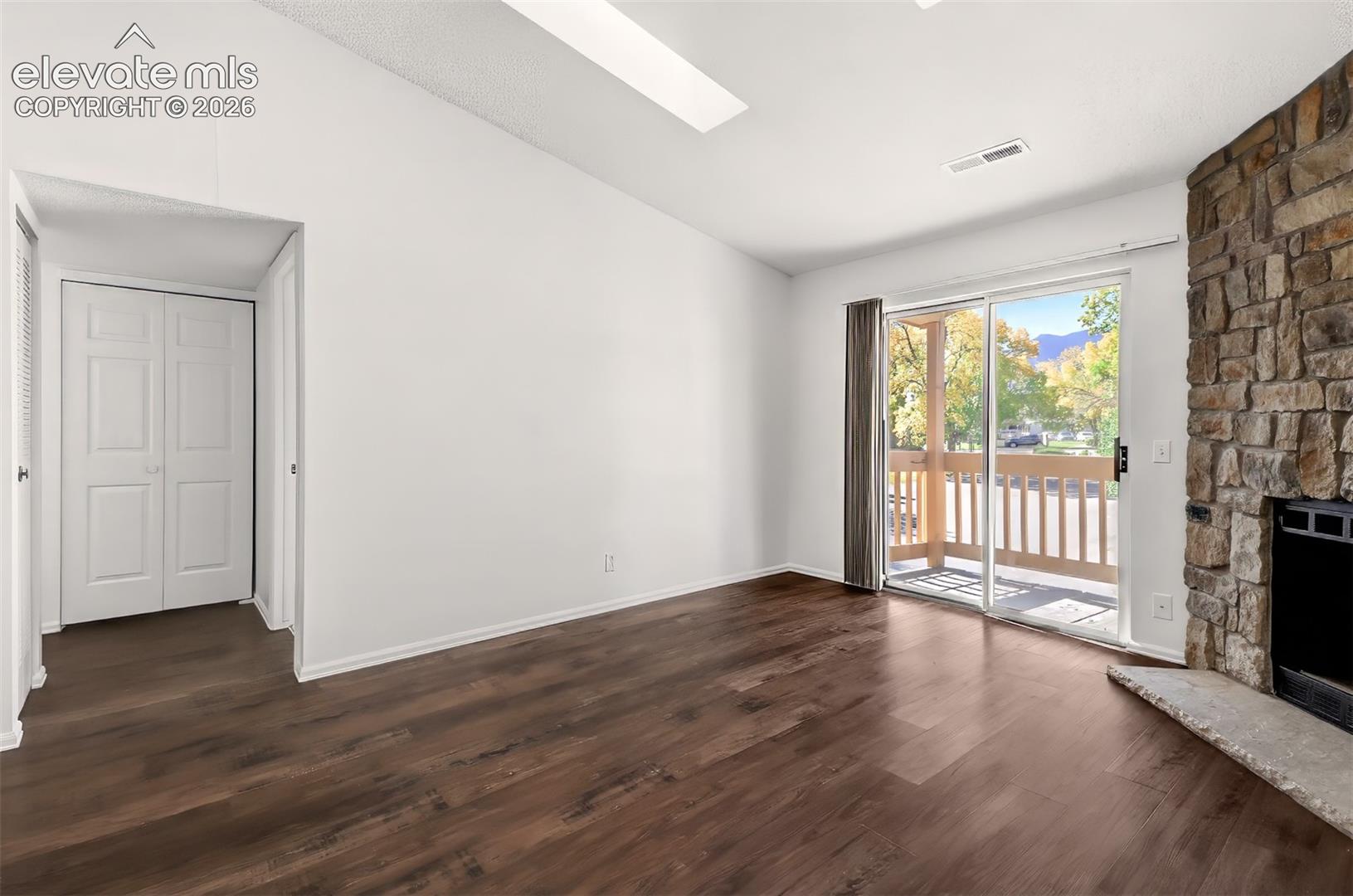 Access the private balcony from the living room. 