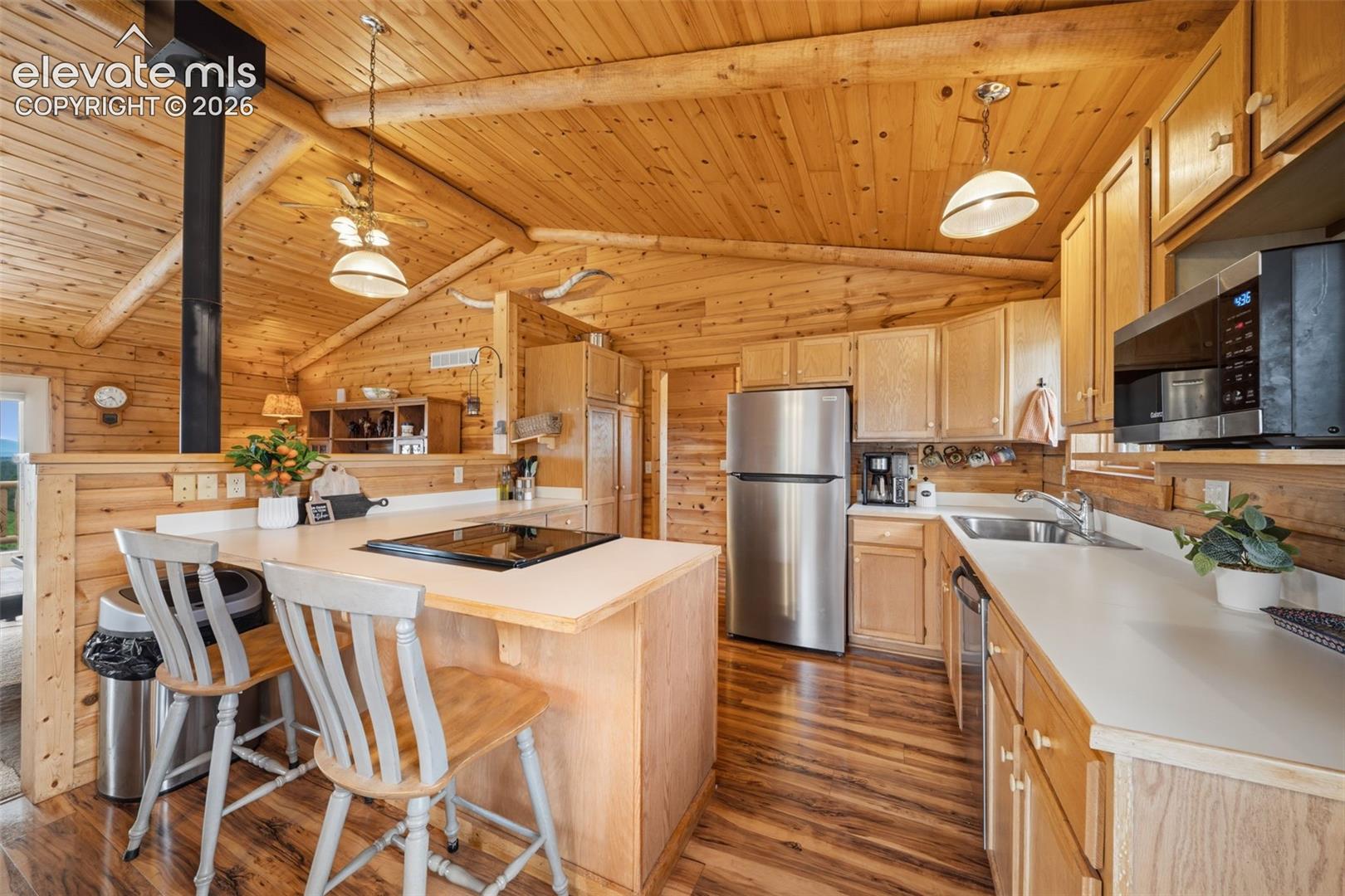 Main level kitchen with newer stainless steel appliances (2025)