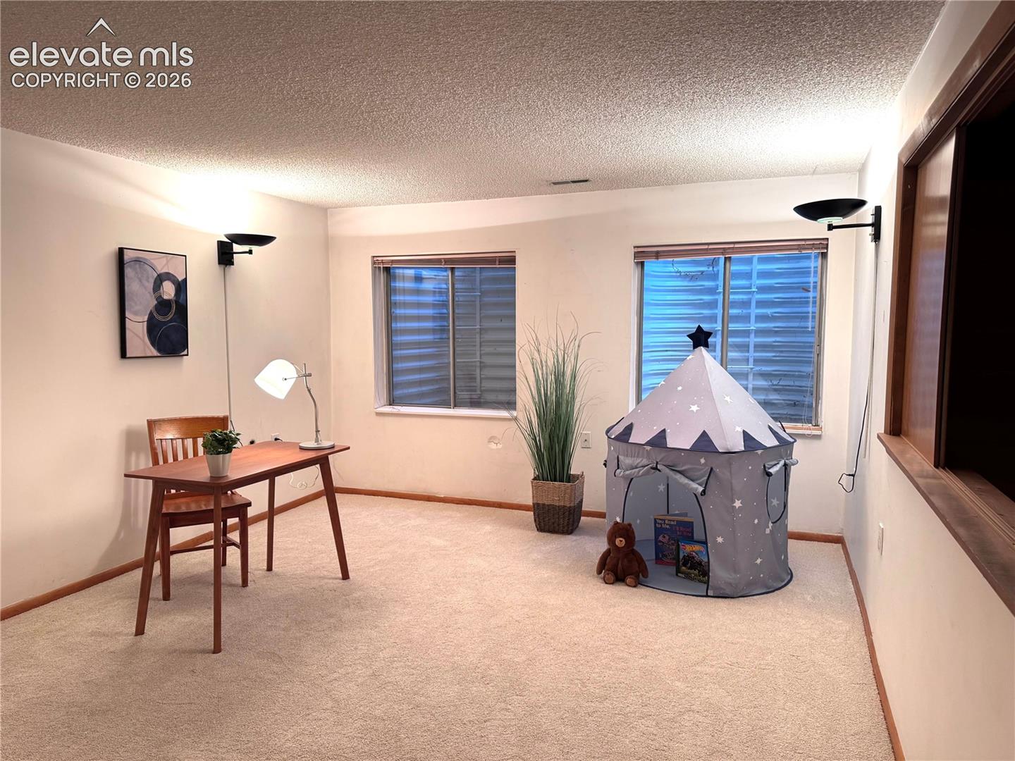 A versatile basement family room for movie nights, game time, play room, or relaxation.