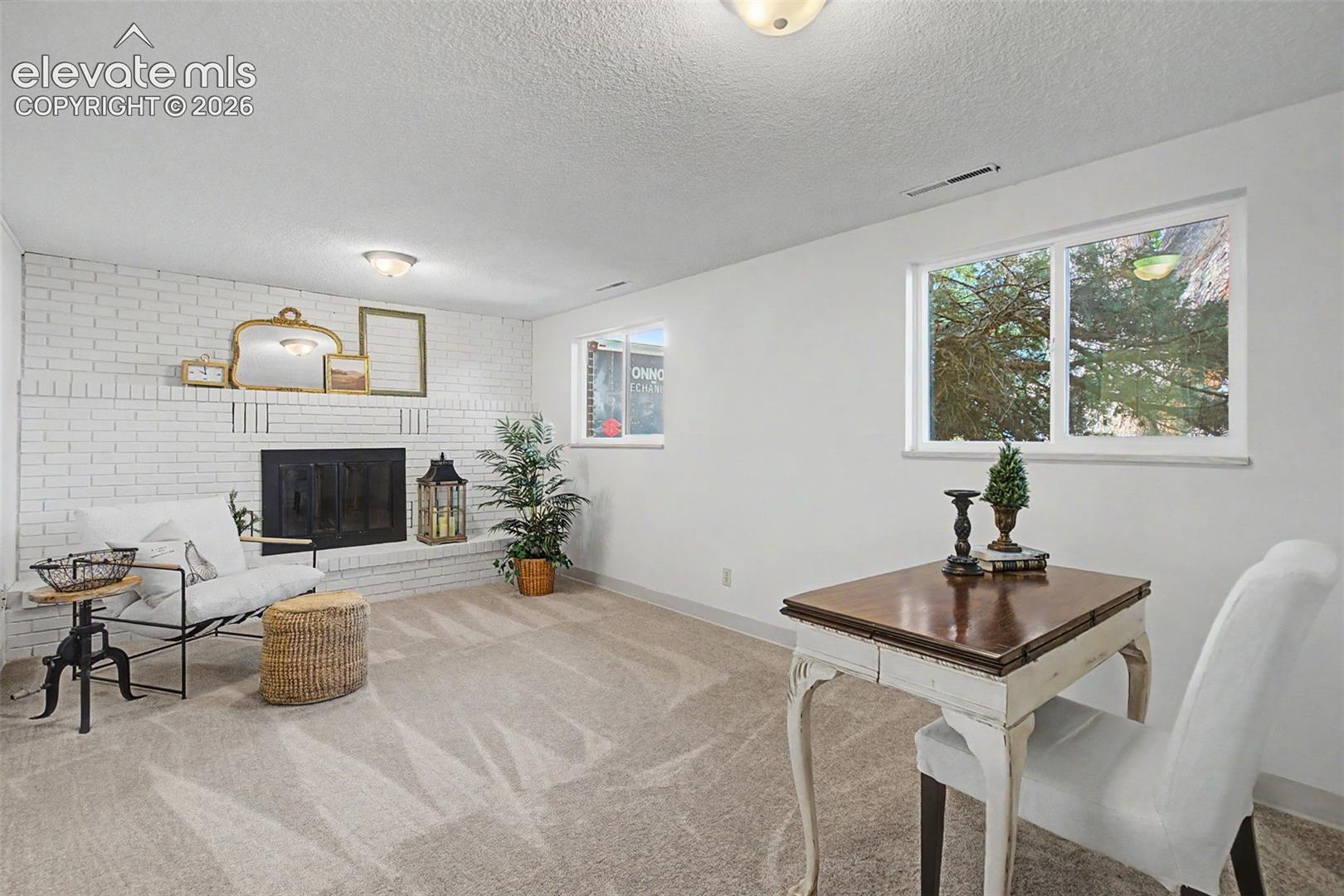 lower level family room complete with a wood-burning fireplace