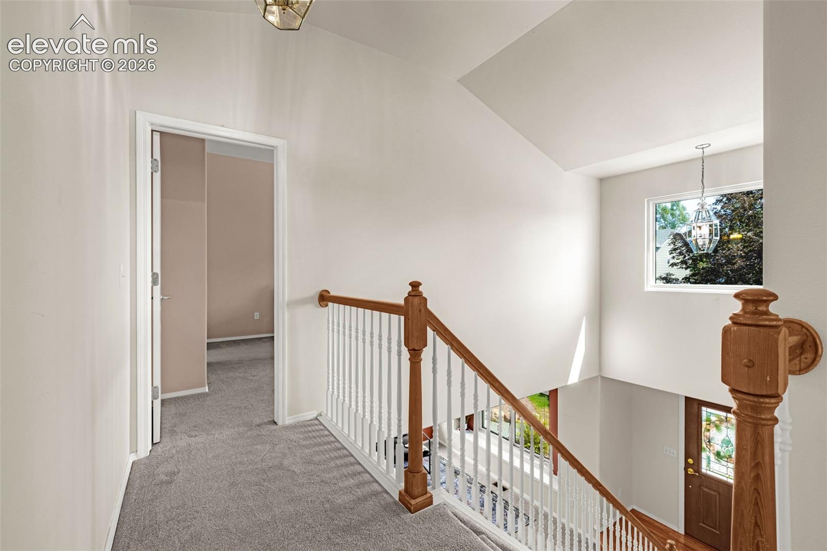 Upstairs landing into Primary Suite