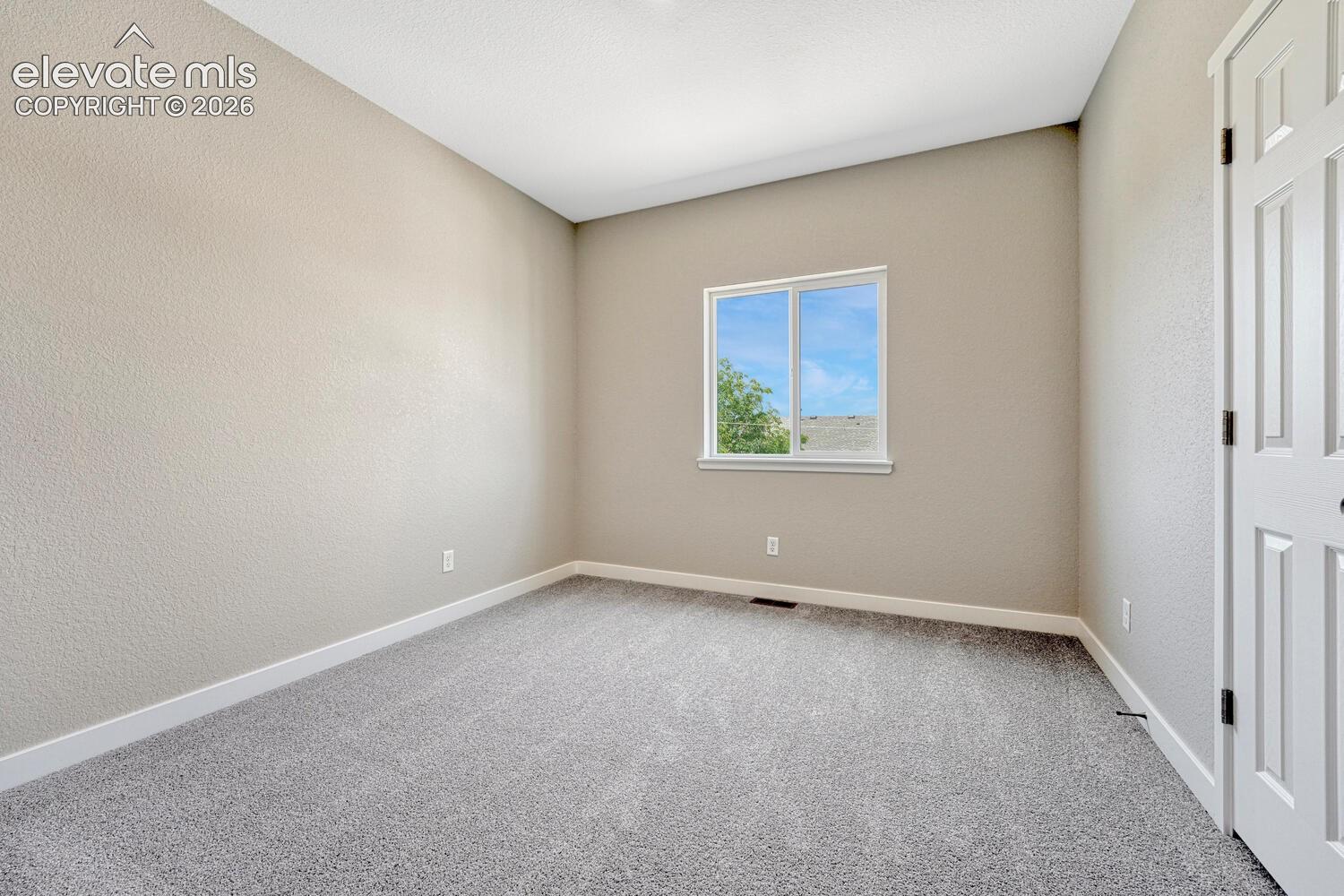 Two secondary bedrooms on upper level.