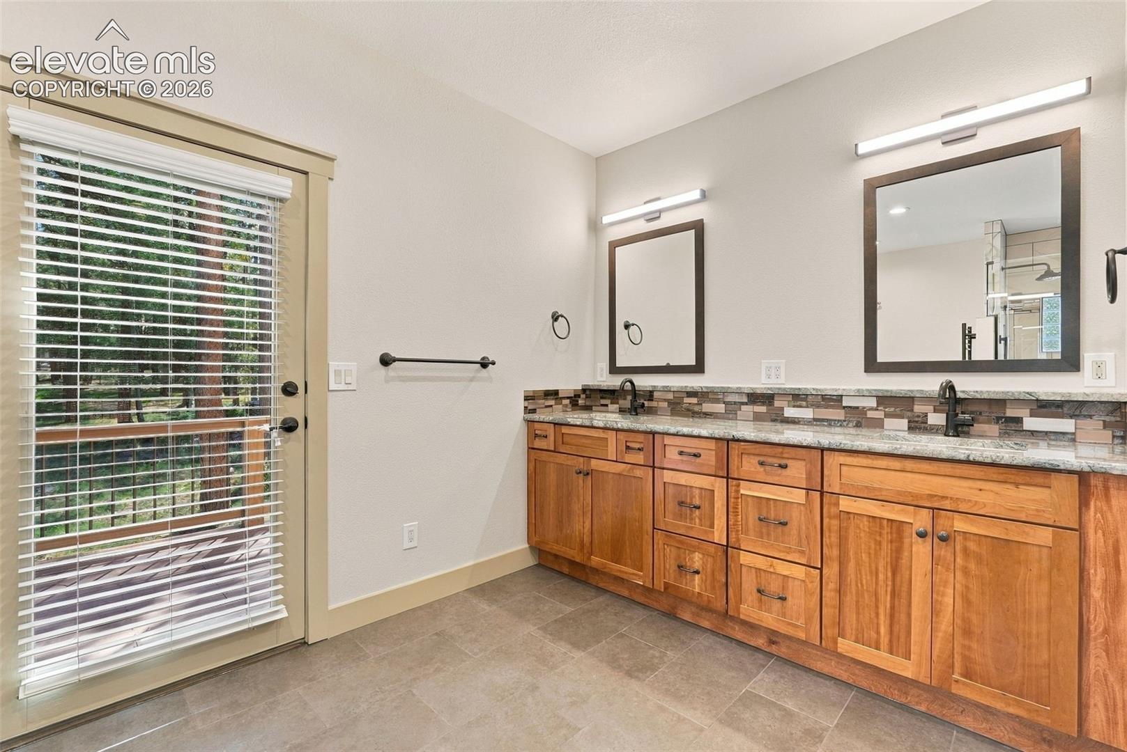 Dual vanity sinks in 5 piece primary bathroom