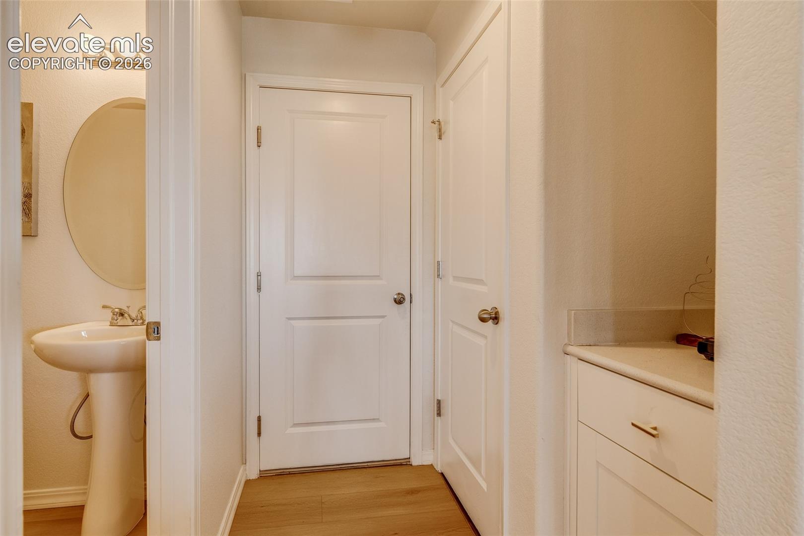 Half bath, garage door and coffee bar area