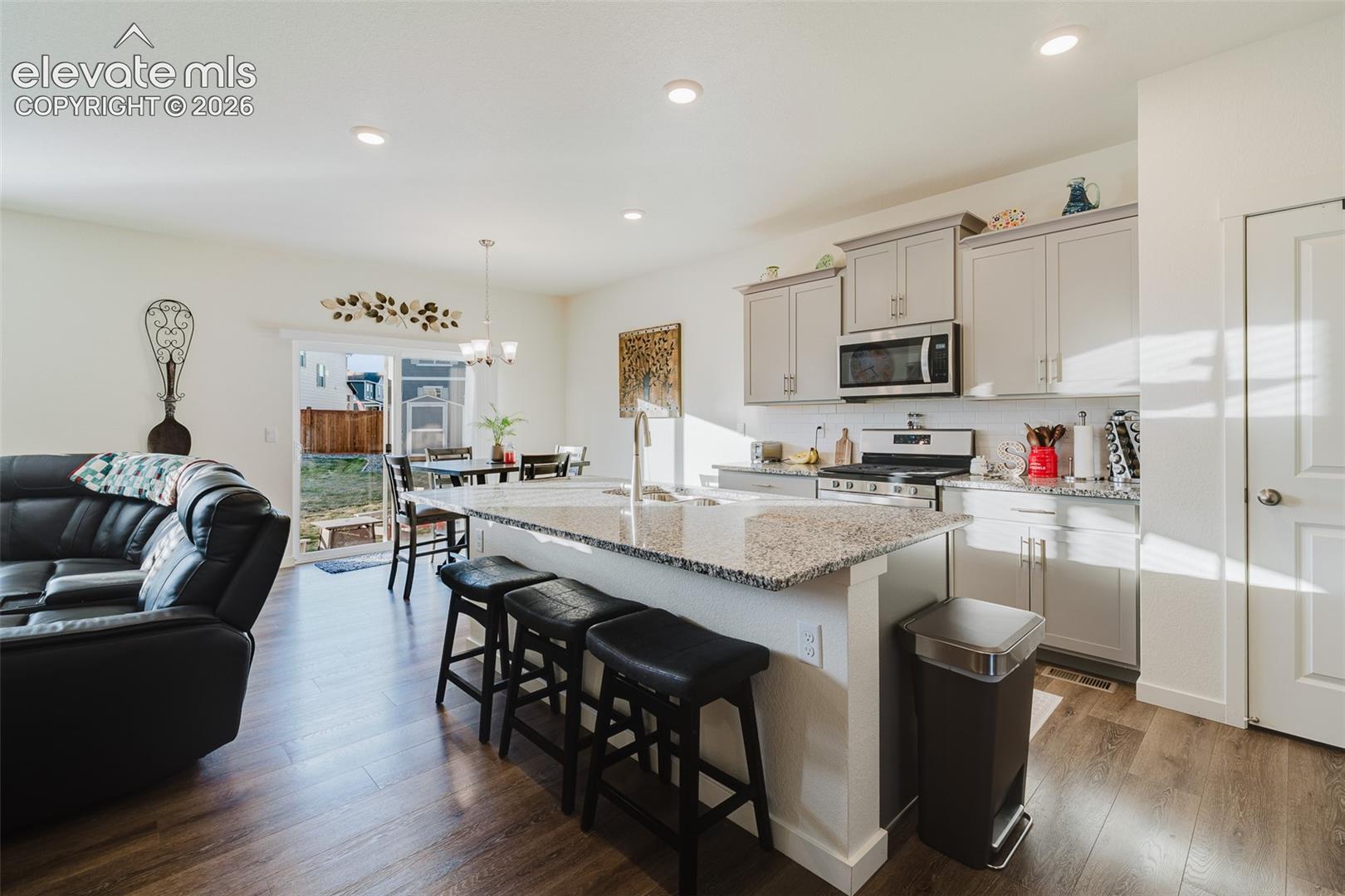 Open main level where the Living Room, Dining Nook, and Kitchen flow seamlessly together, ideal for everyday living and entertaining.
