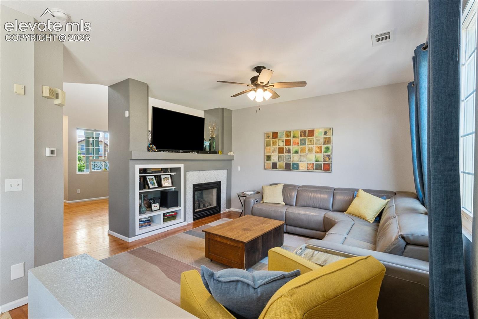 Family room with fireplace  & built-ins.