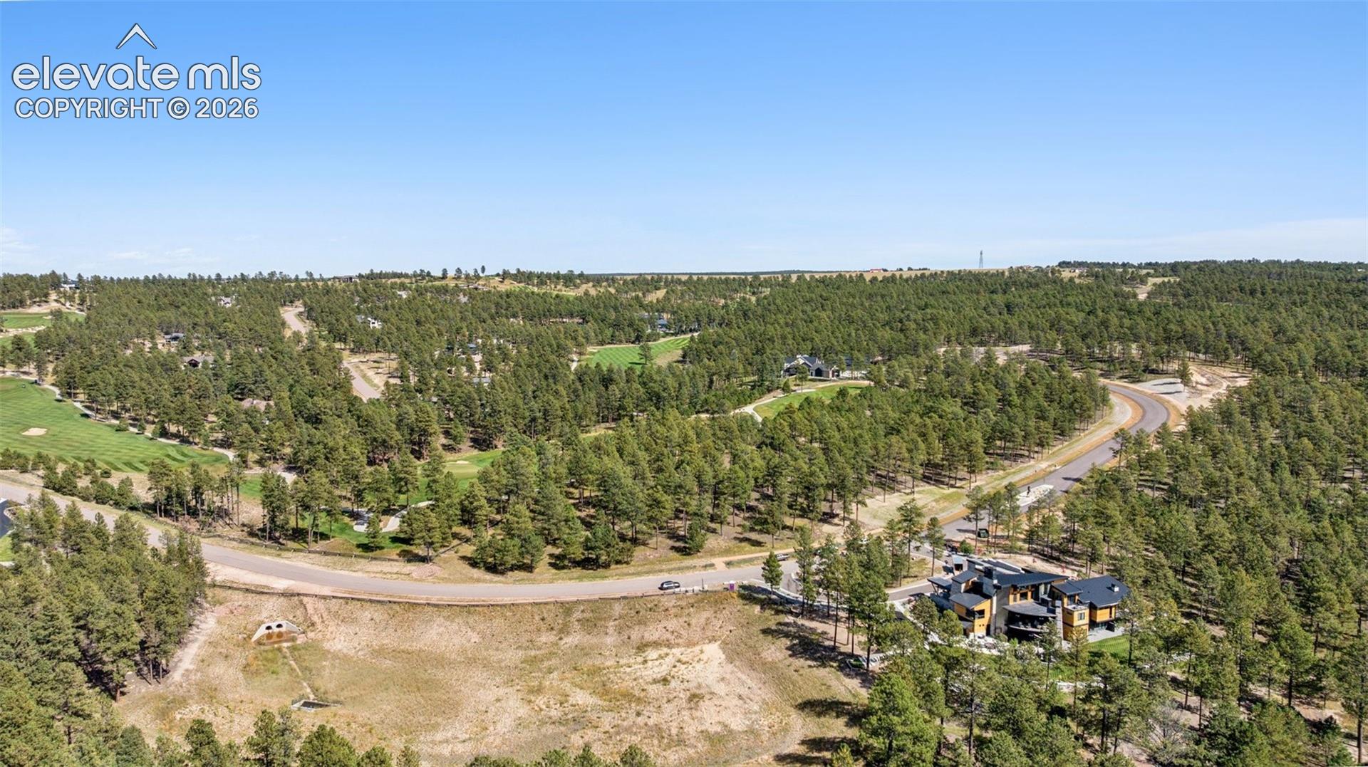 2024 Parade Home on Adjacent Lot and detention pond, no home here. Preserved view. 