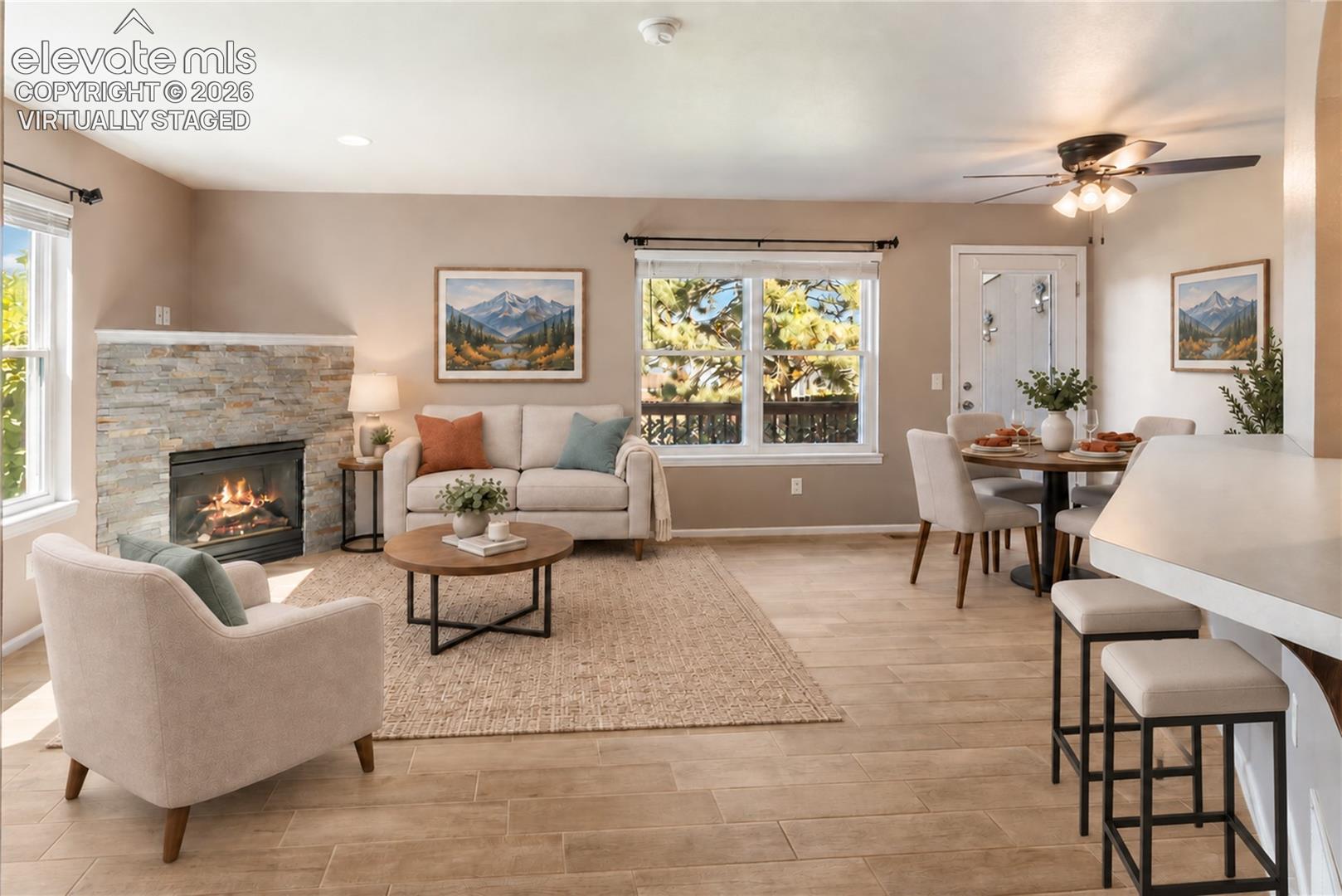 Virtually Staged-New floors and stacked stone on fireplace. Walks out to back deck.