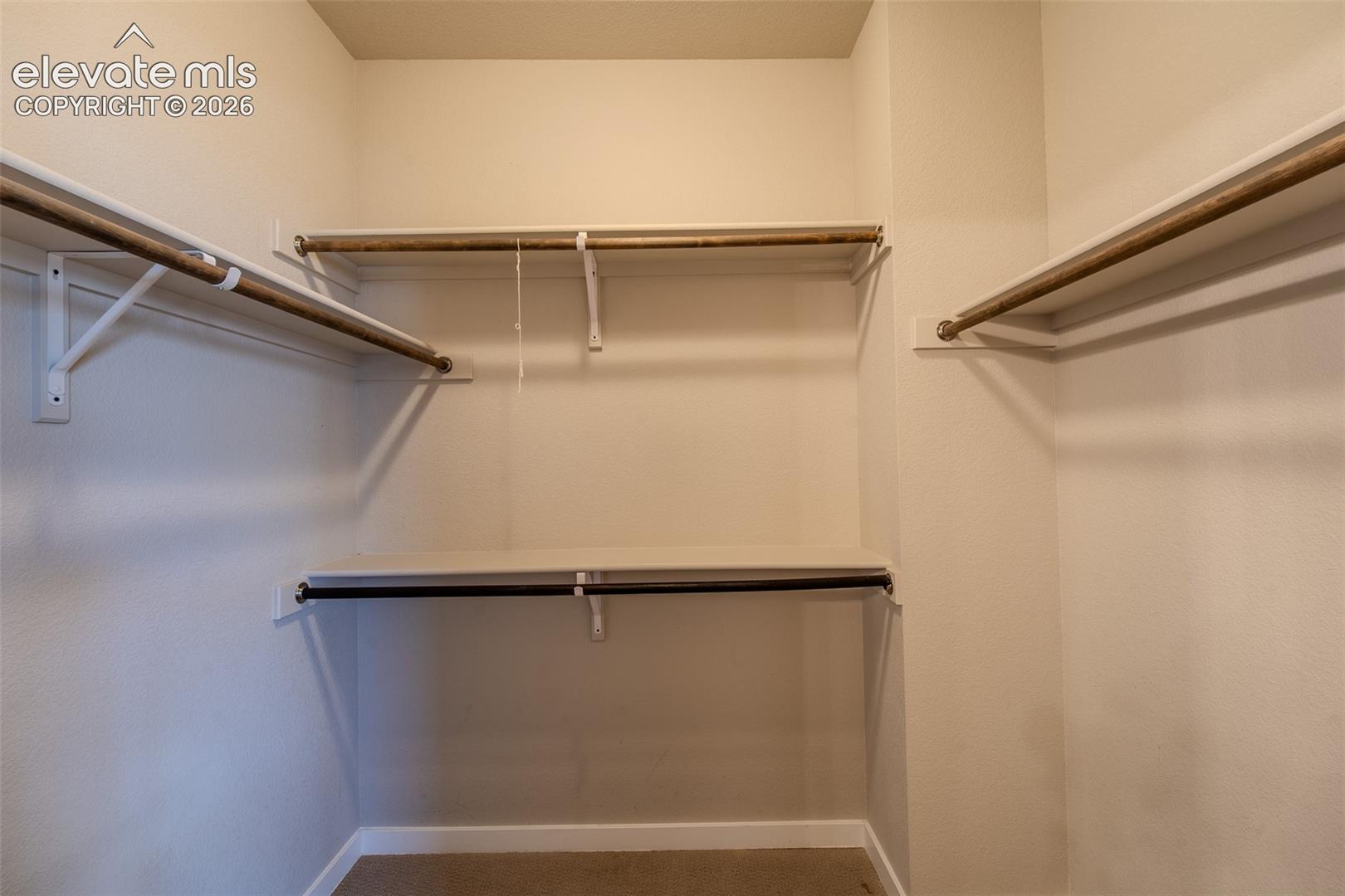 Primary Bedroom walk-in closet.