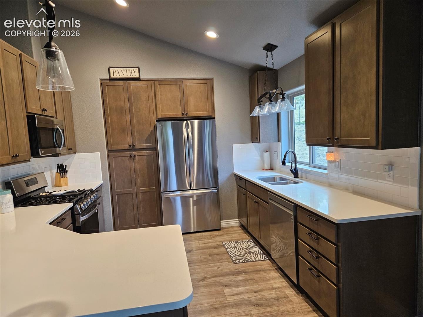 lot of cabinets with a pantry