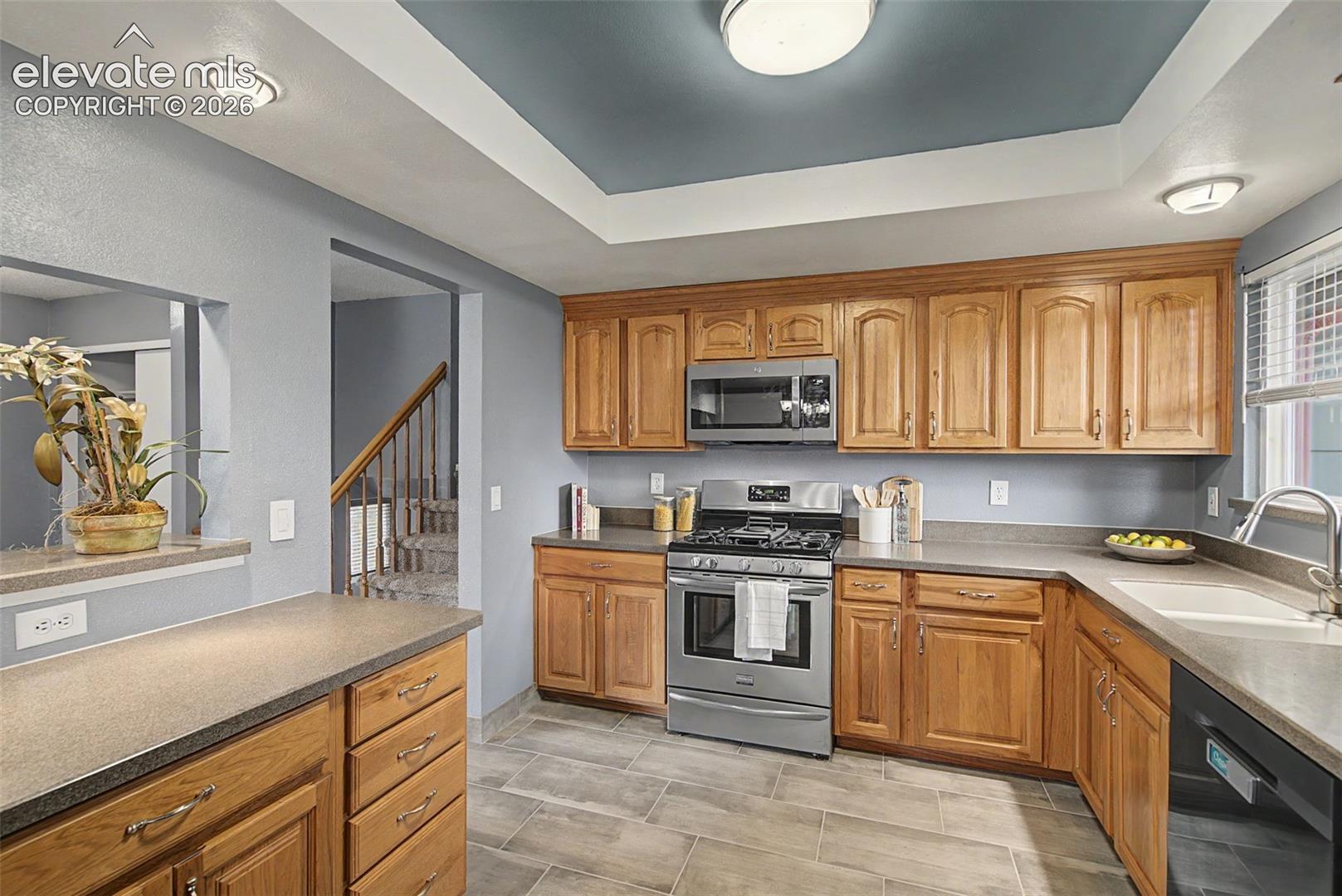 Kitchen with Quartz Countertops and Stainless Steel Appliances
