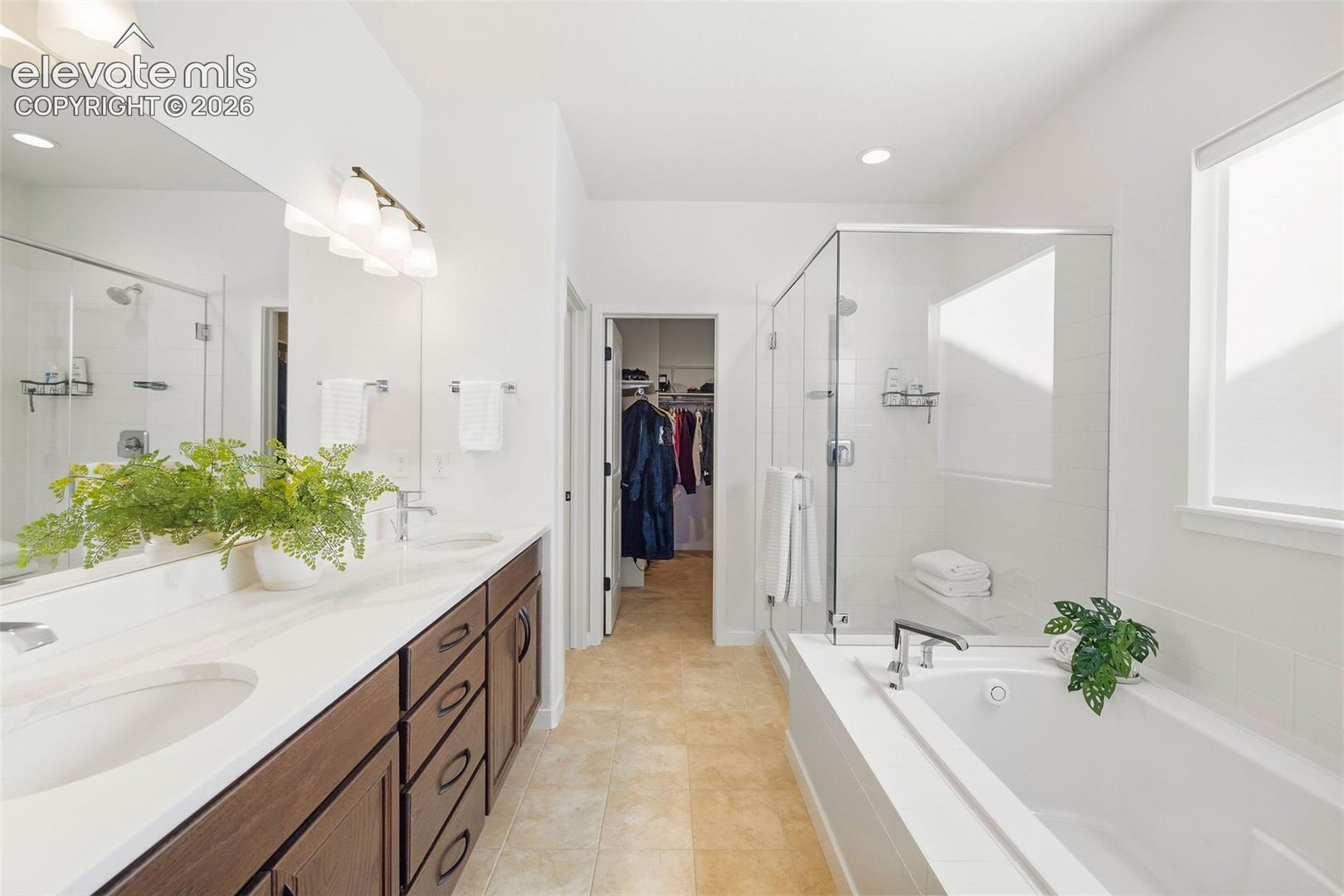 The primary bath is a five-piece and offers a measure of calm to start and end your days. 