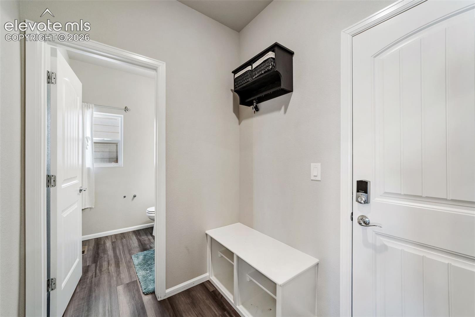 Functional mud room with built-in bench and storage area.