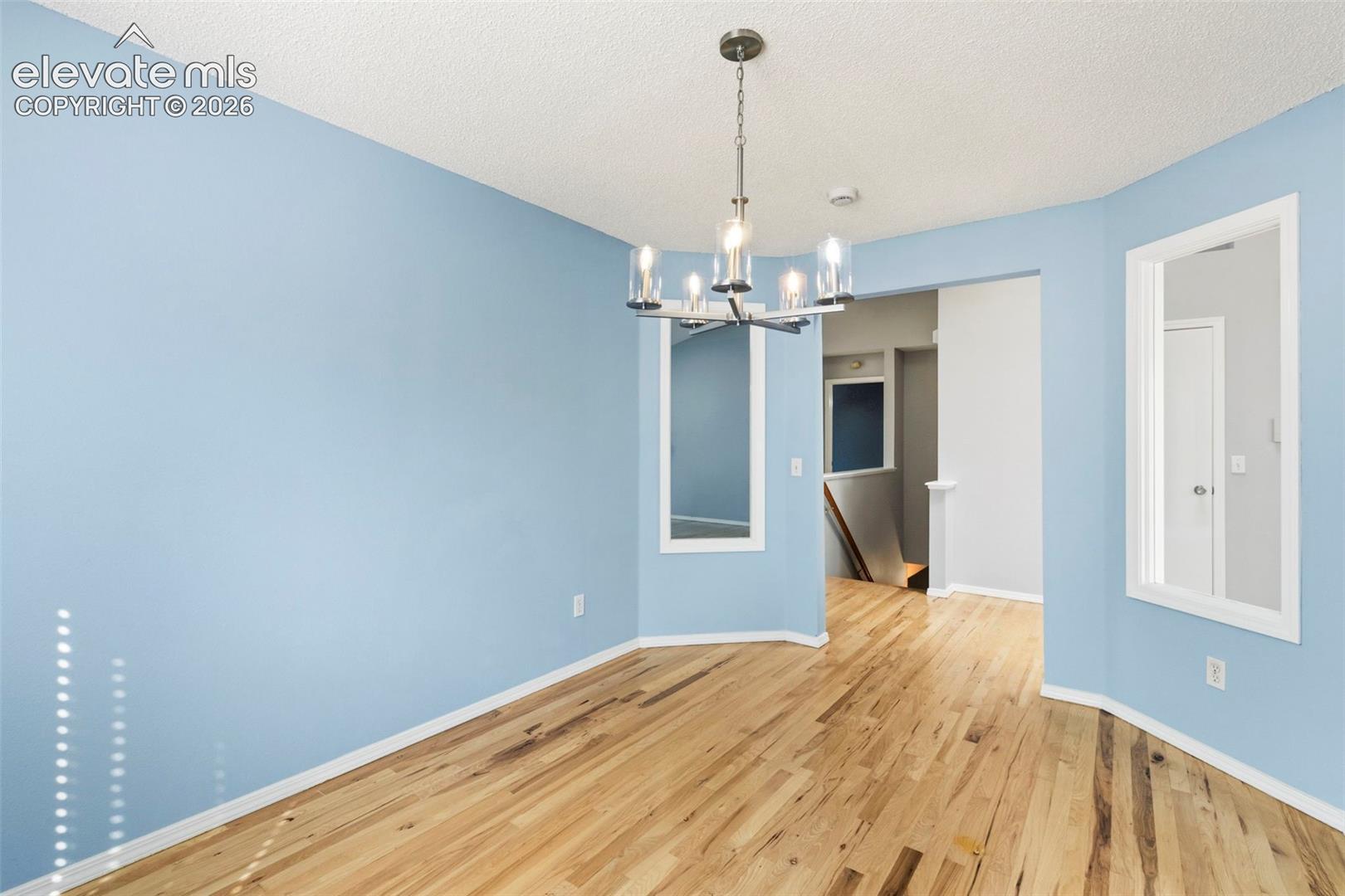 Separate dining room w/ updated light fixture