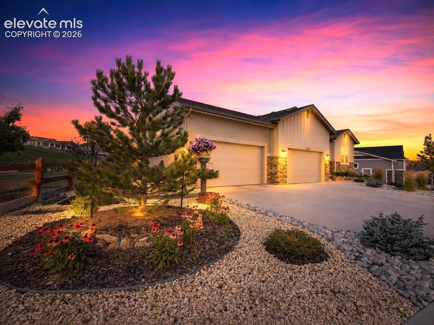 A SETTING THAT IMPRESSES — Perfectly situated on a prominent corner lot, offering sweeping open views and a spacious, elevated feel.