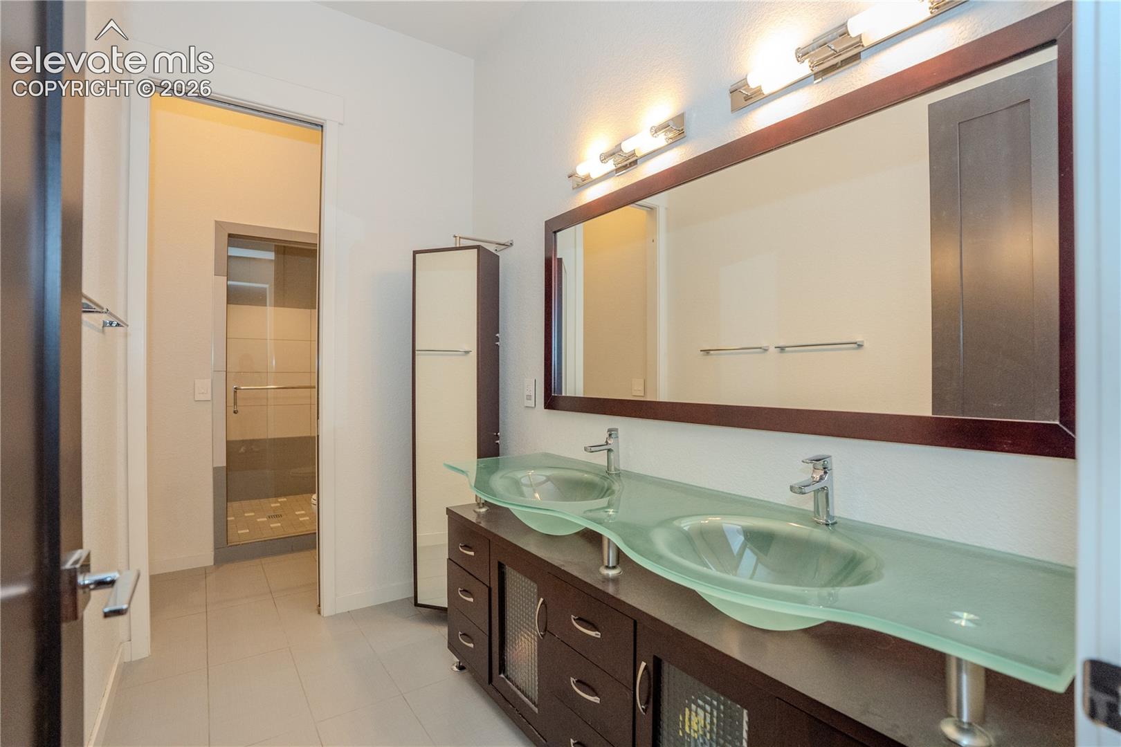 Double vanity and walk in shower in the bath downstairs