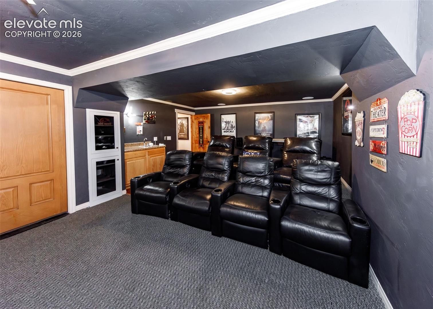 Theater room seats 11 people comfortably.