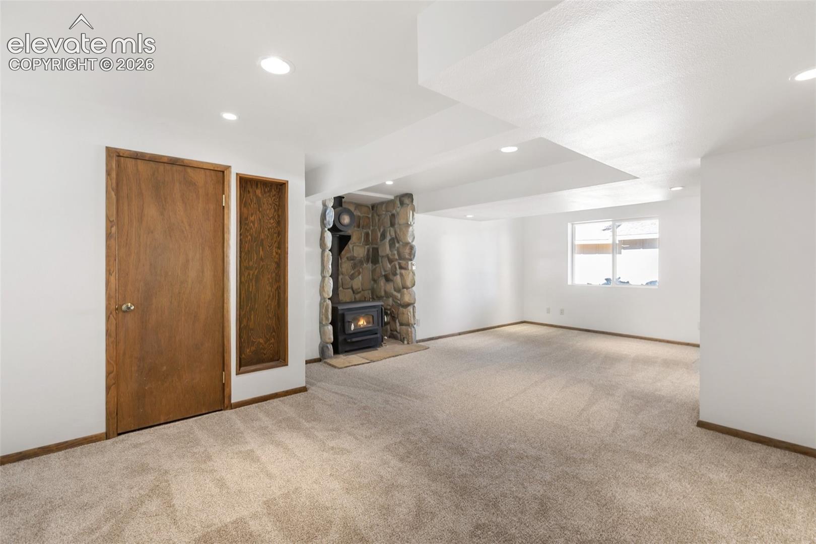 Walk out family room with wood stove.