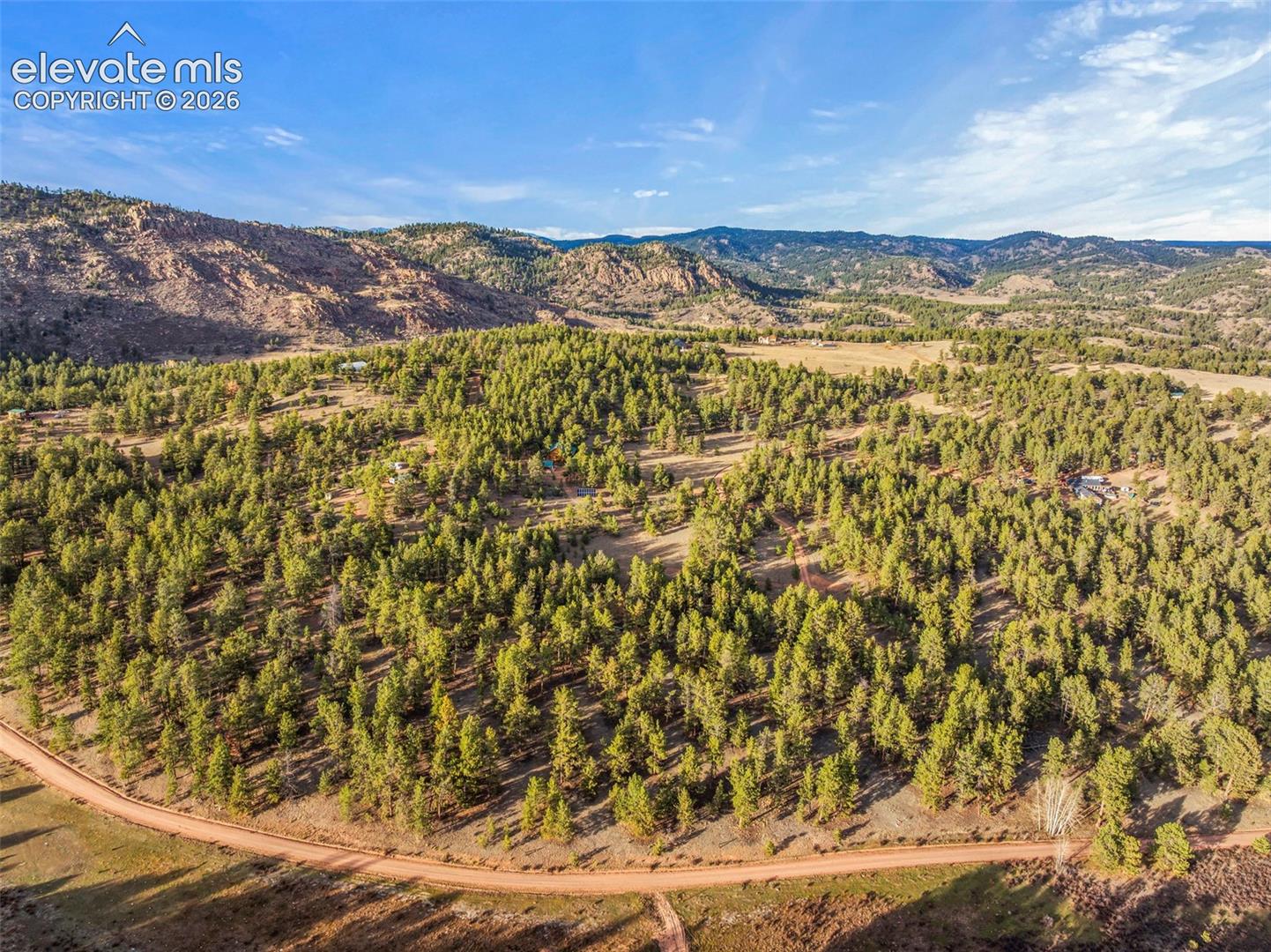 Expansive acreage featuring dense evergreen timber, natural topography, and mountainous terrain