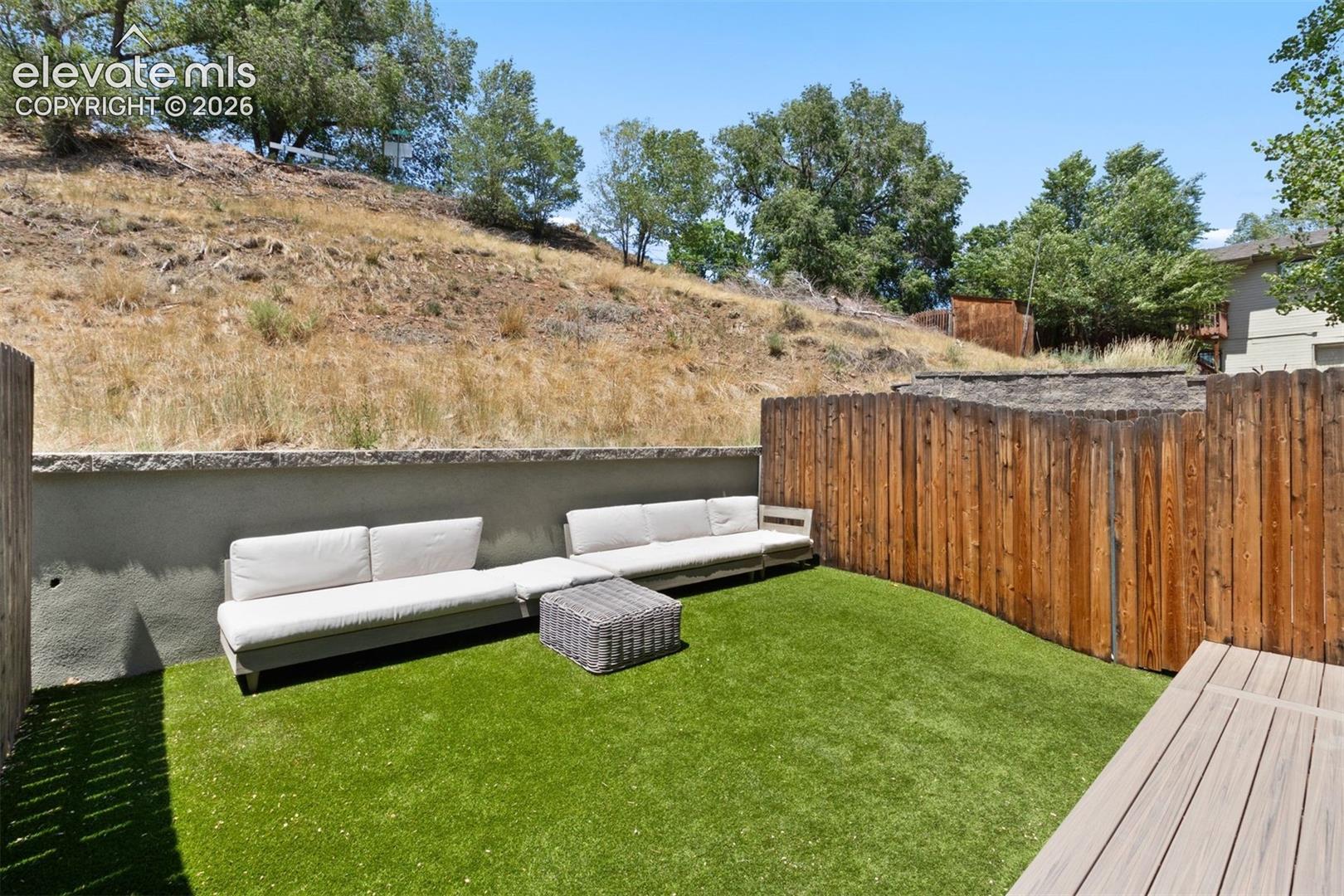 Patio with included furniture and turf yard