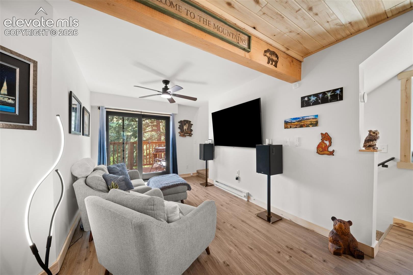 Main leve living area with walk out to deck